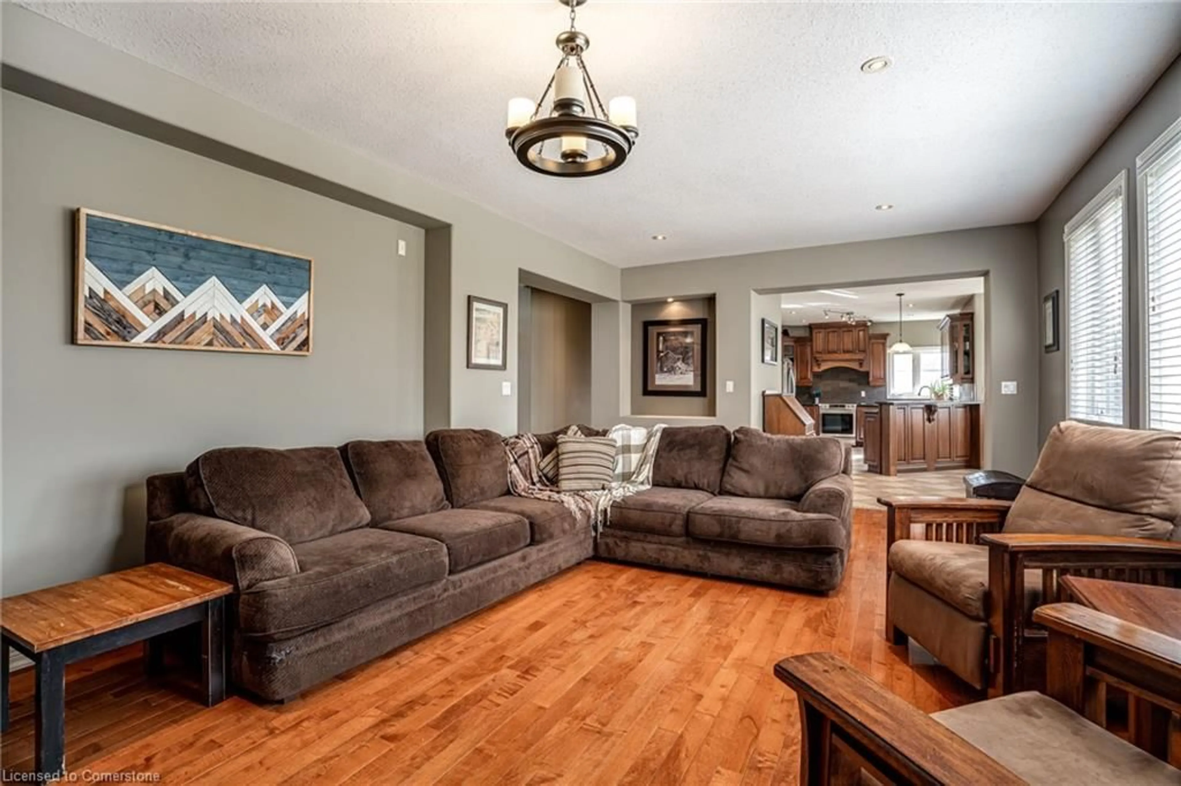 Living room with furniture, wood/laminate floor for 108 Sunnyridge Rd, Ancaster Ontario L0R 1R0