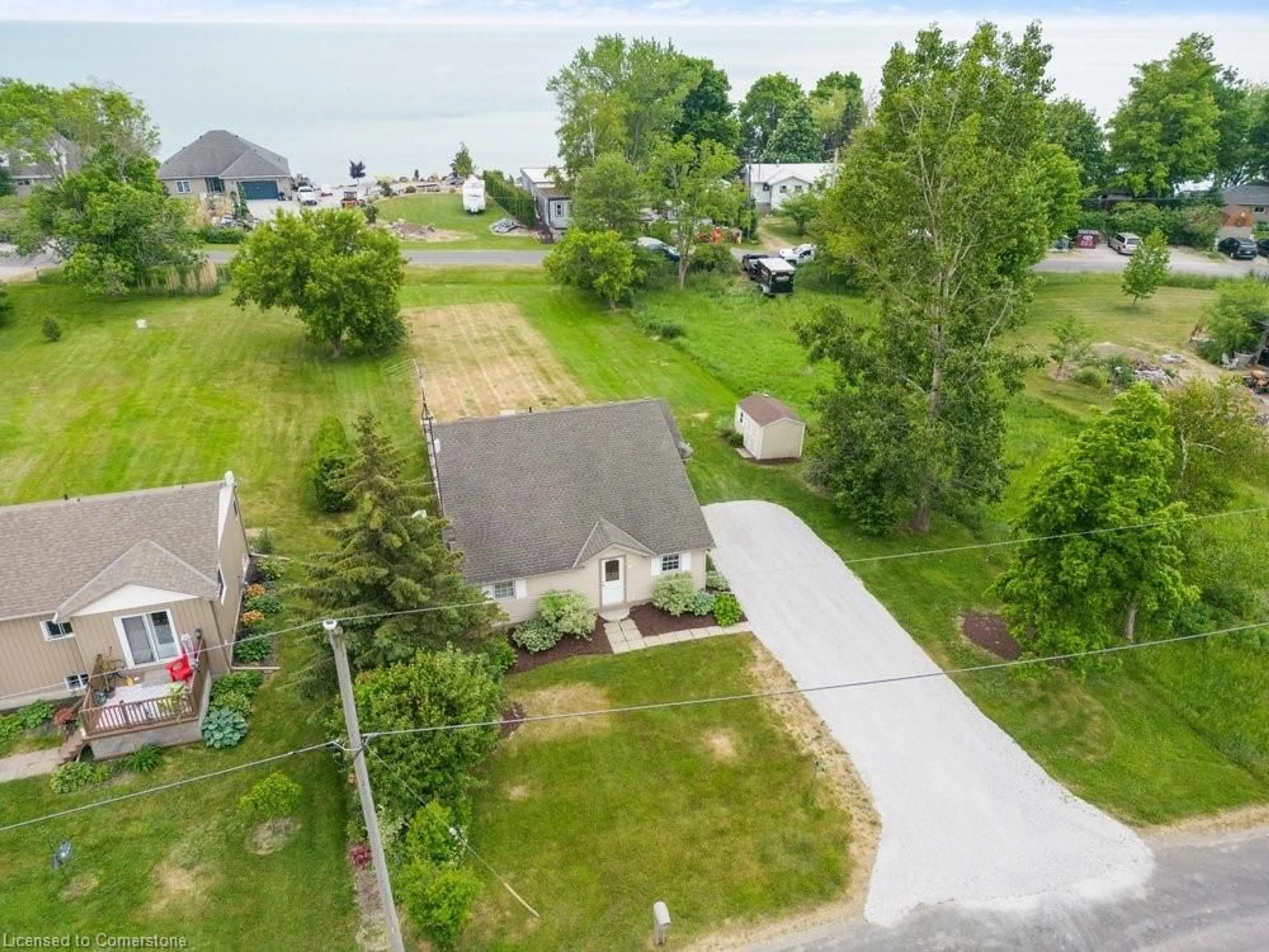 A pic from outside/outdoor area/front of a property/back of a property/a pic from drone, water/lake/river/ocean view for 30 Old Lakeshore Rd, Port Dover Ontario N0A 1N3