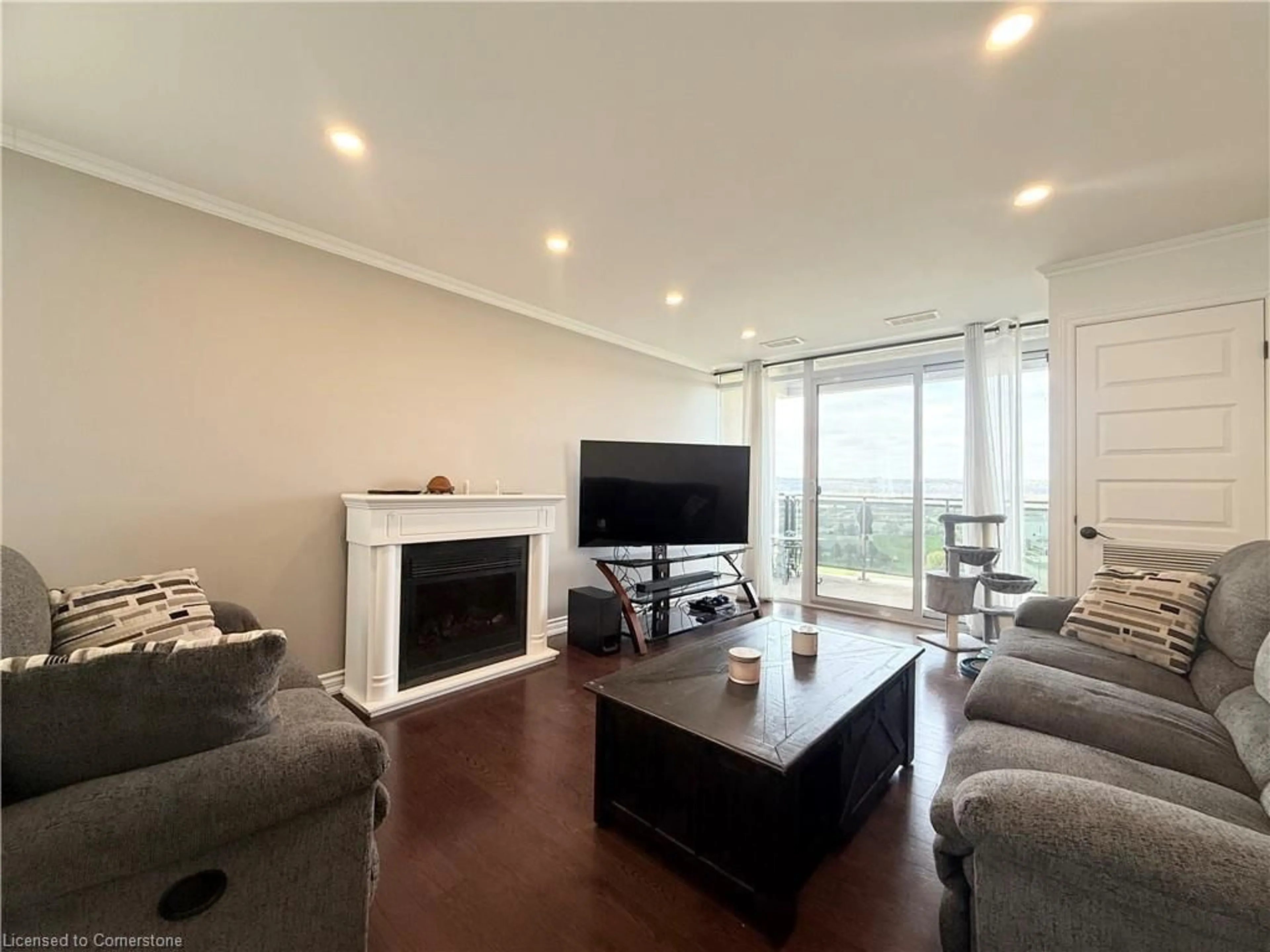 Living room with furniture, wood/laminate floor for 301 Frances Ave #1903, Hamilton Ontario L8E 3W6