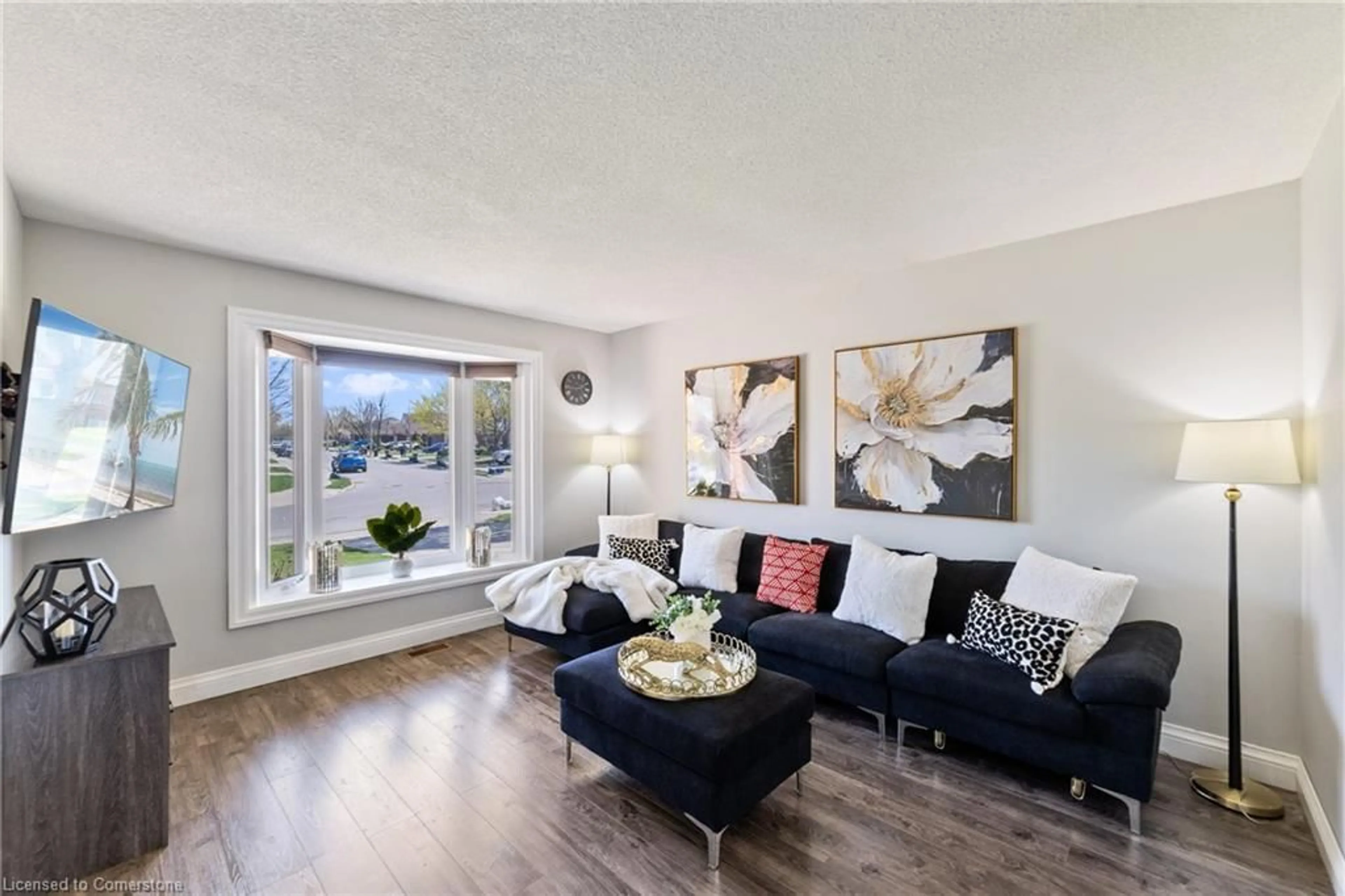 Living room with furniture, wood/laminate floor for 741 Acadia Dr, Hamilton Ontario L8W 3V2