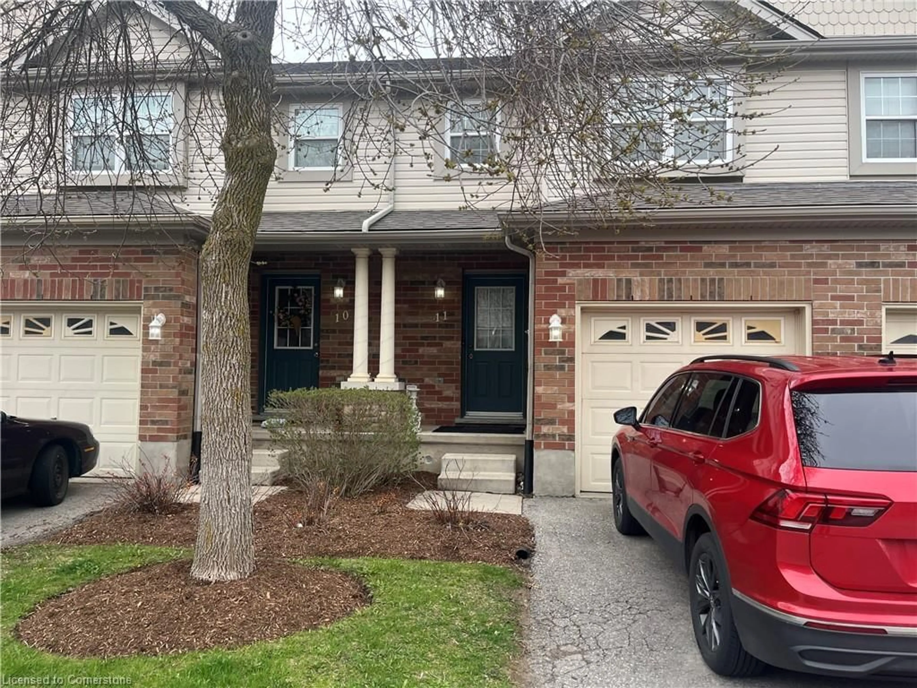 Home with brick exterior material, street for 30 Imperial Rd S Rd #11, Guelph Ontario N1K 1Y2