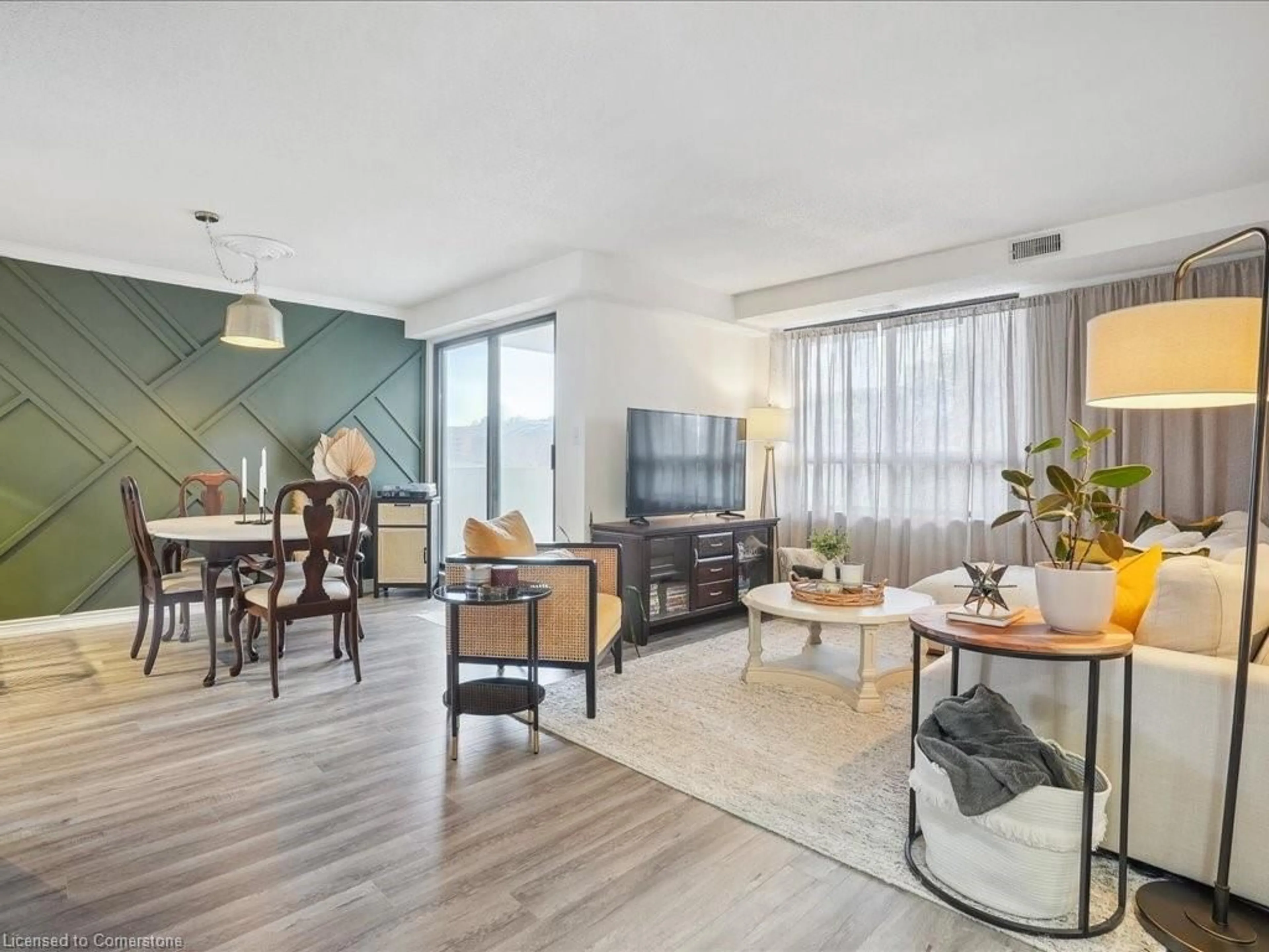 Living room with furniture, wood/laminate floor for 432 Main St #504, Hamilton Ontario L8N 1J9