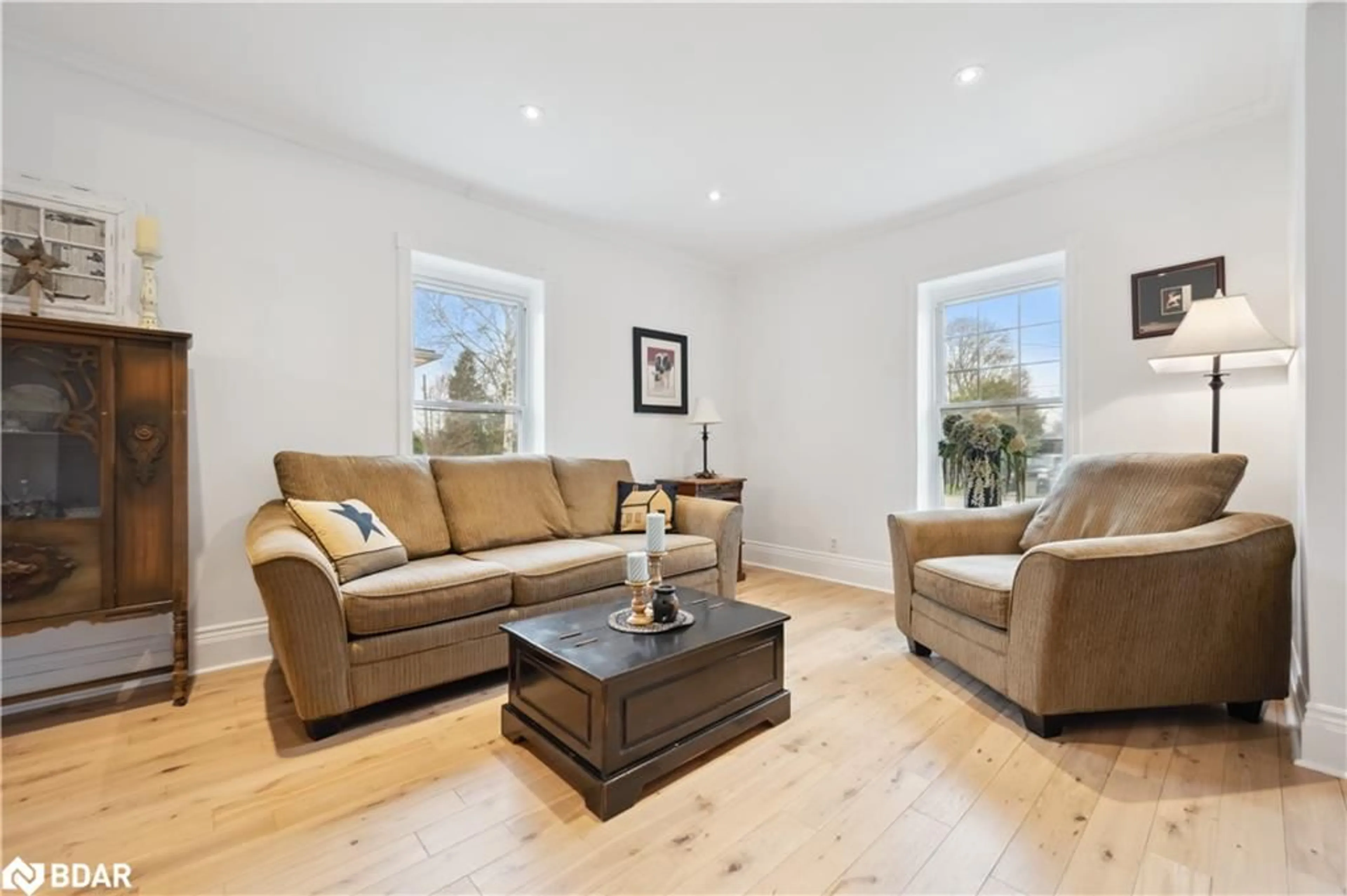 Living room with furniture, wood/laminate floor for 42 Bielby St, Grand Valley Ontario L9W 5N3
