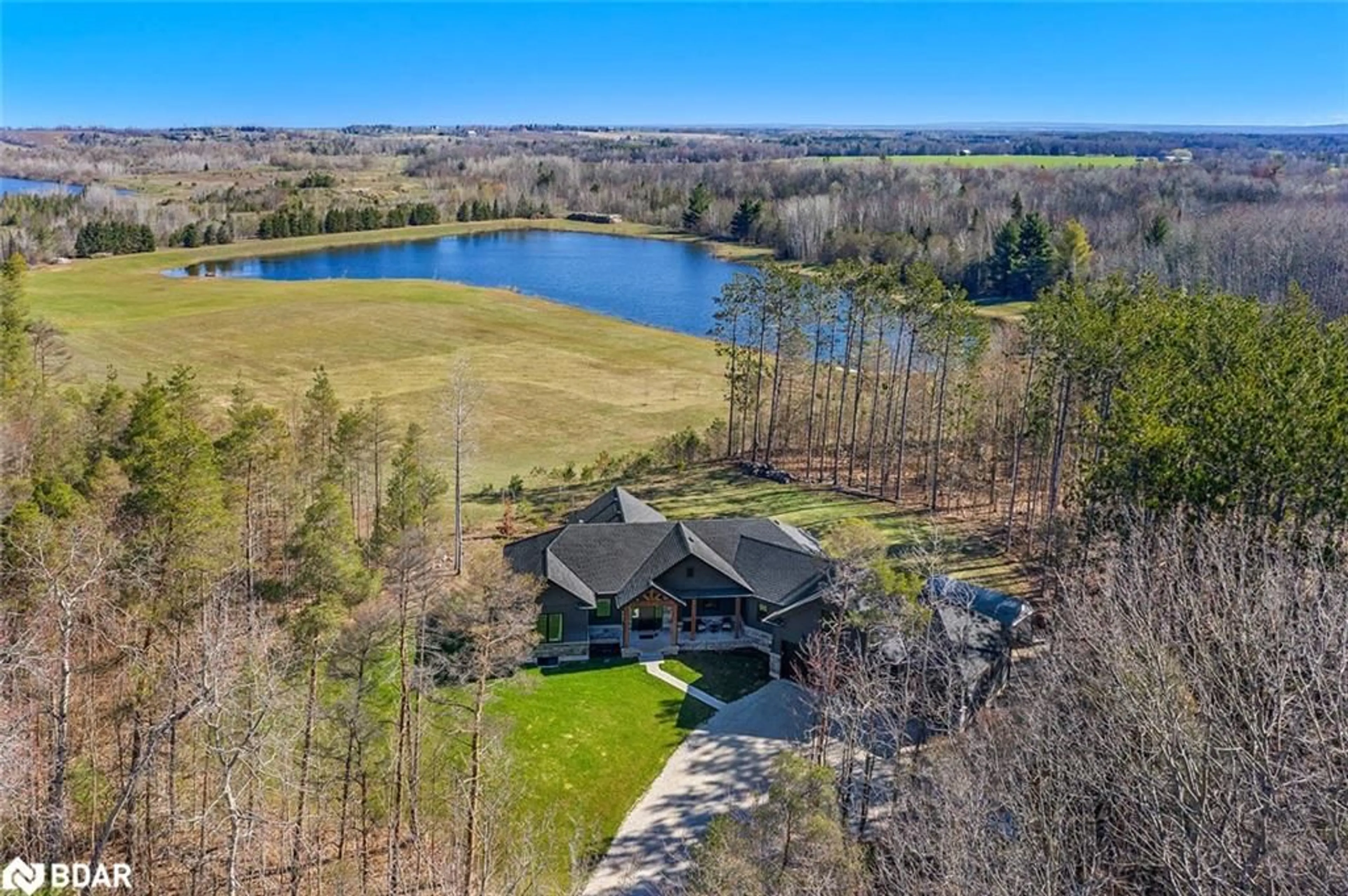 A pic from outside/outdoor area/front of a property/back of a property/a pic from drone, water/lake/river/ocean view for 3091 Centre Line Road, New Lowell Ontario L0M 1N0