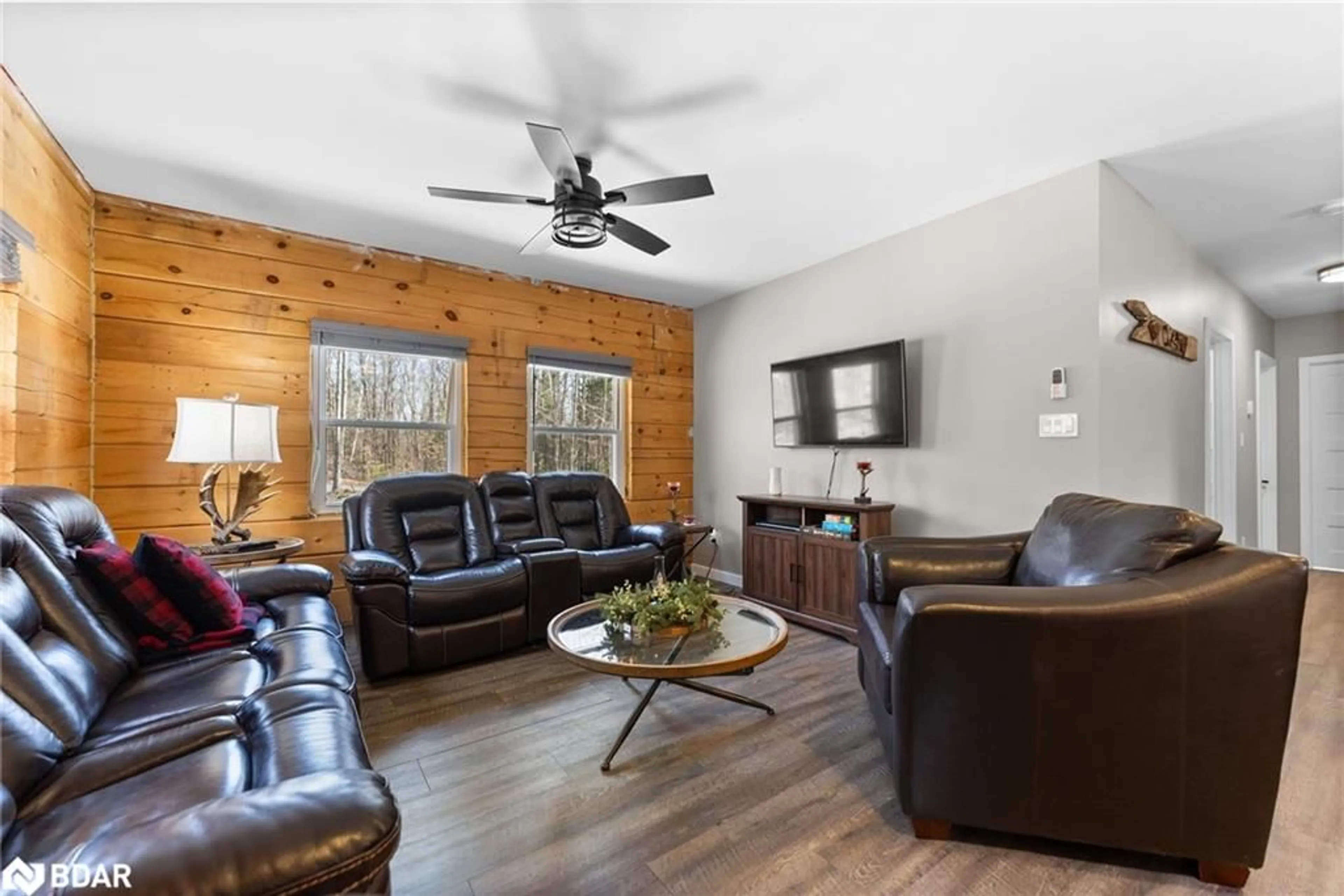 Living room with furniture, wood/laminate floor for 2075 Dyno Rd, Cardiff Ontario K0L 1M0
