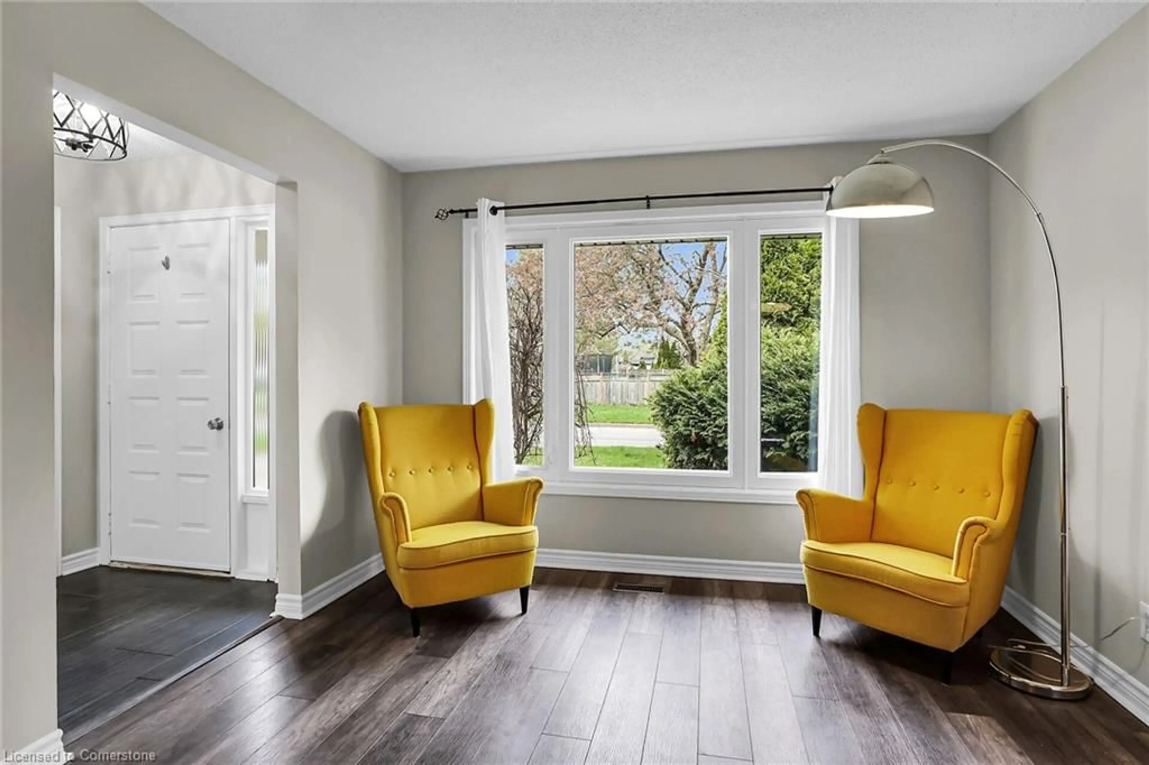 Living room with furniture, wood/laminate floor for 12 Mcnicholl Cir, St. Catharines Ontario L2N 7C5