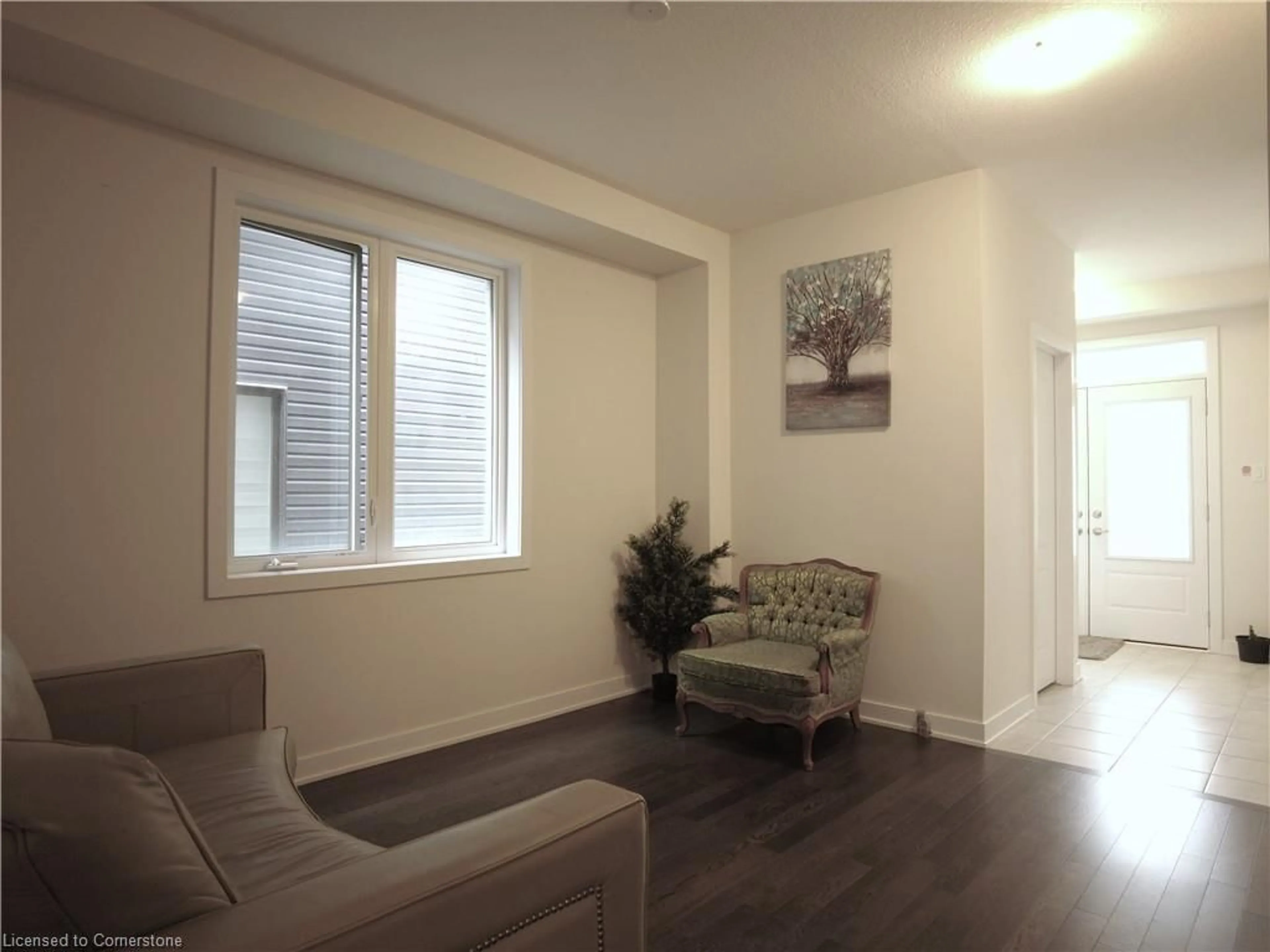 Living room with furniture, wood/laminate floor for 61 Starboard Cres, Welland Ontario L3B 0M7