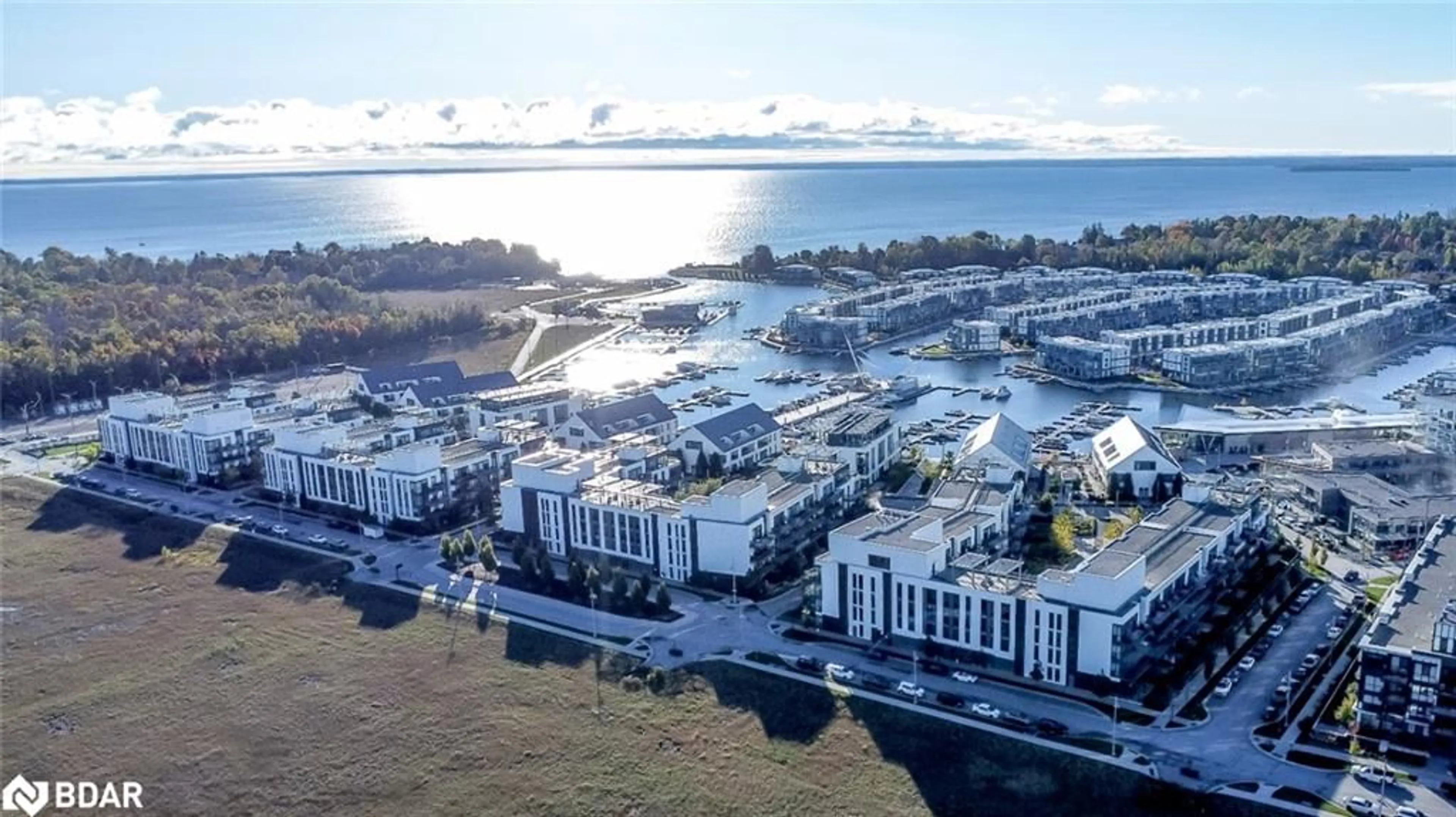A pic from outside/outdoor area/front of a property/back of a property/a pic from drone, water/lake/river/ocean view for 333 Sea Ray Ave #131, Innisfil Ontario L9S 0M3