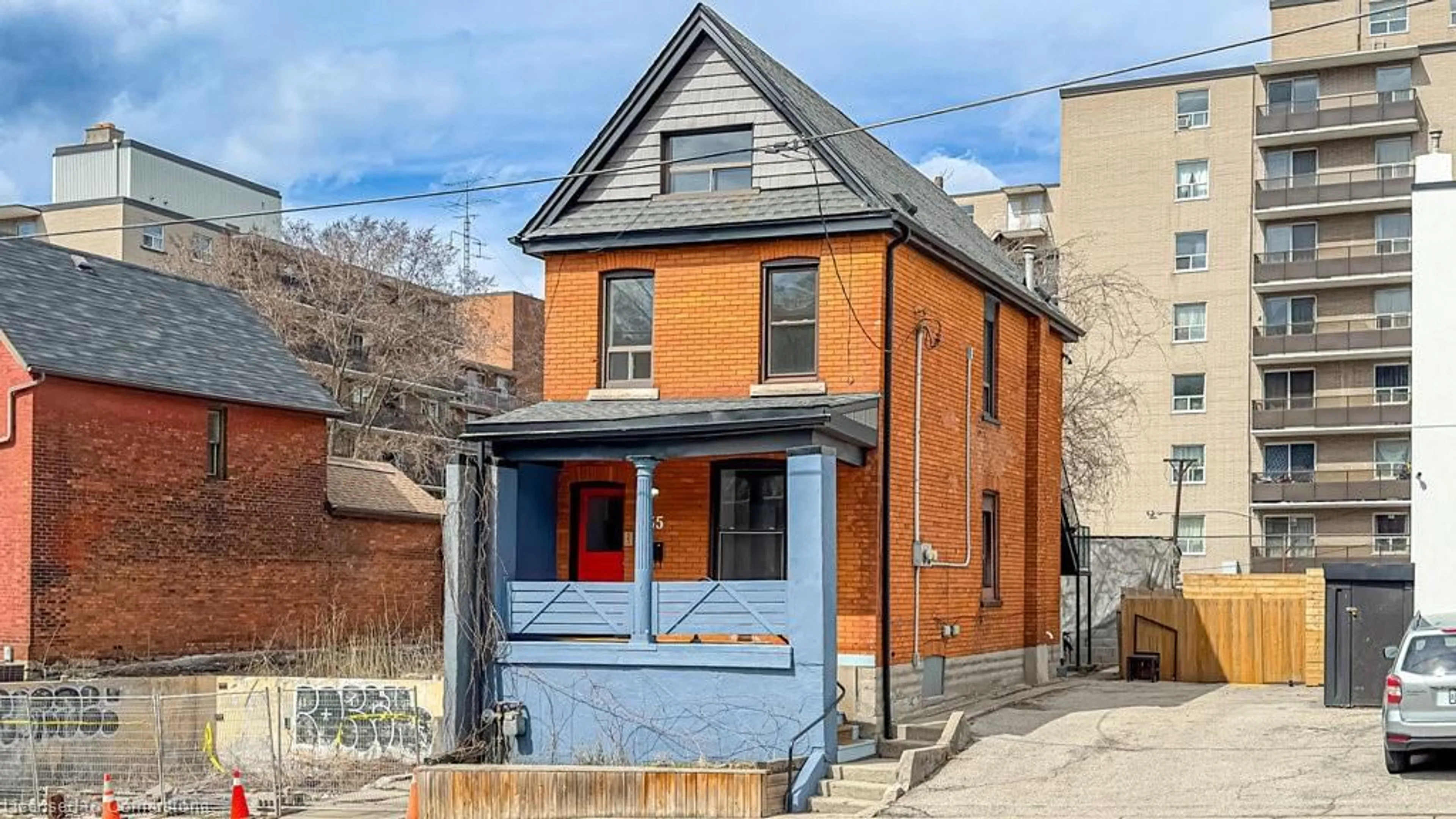 Home with brick exterior material, street for 235 Young St, Hamilton Ontario L8N 1V9