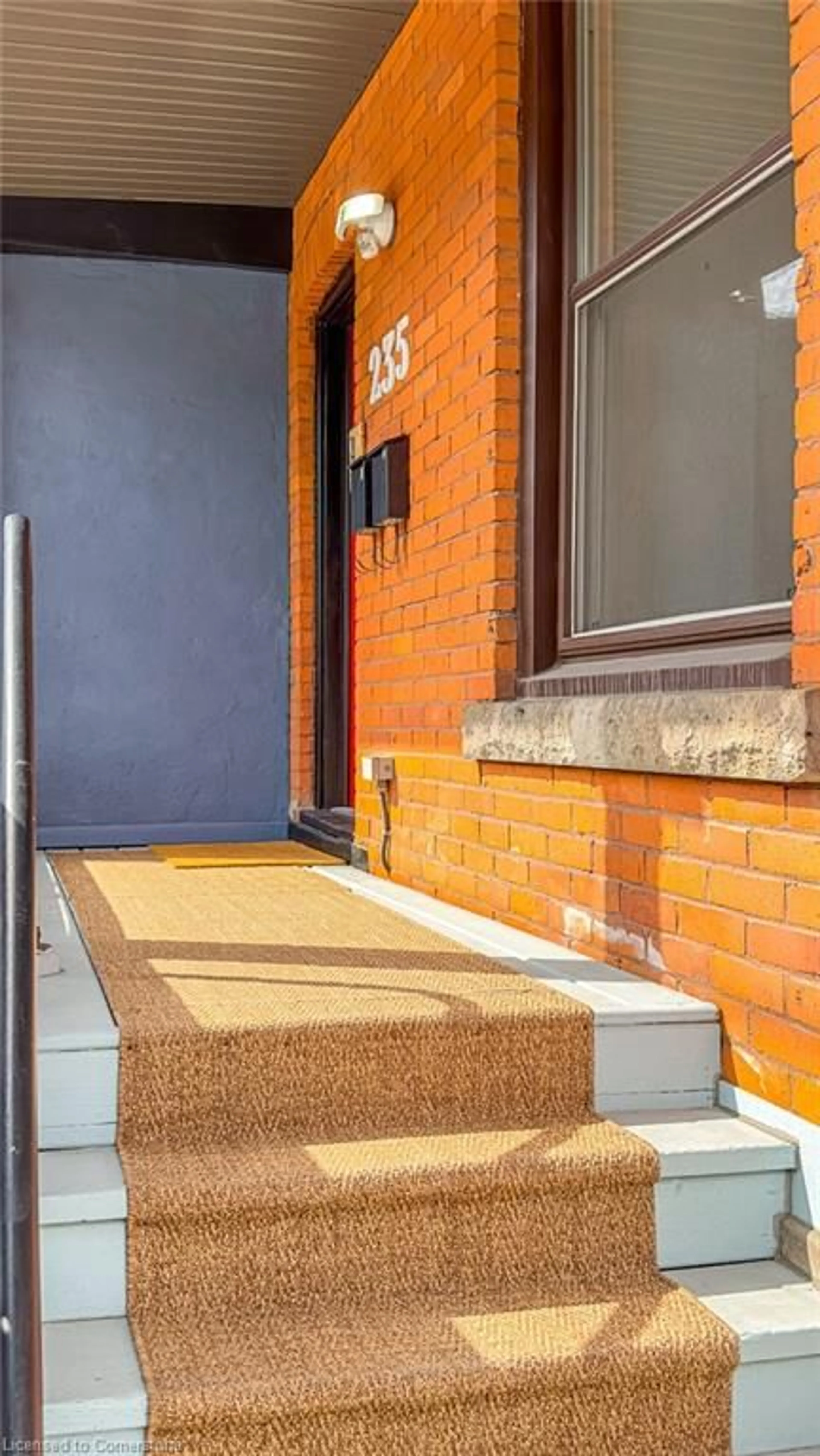 Home with brick exterior material, street for 235 Young St, Hamilton Ontario L8N 1V9