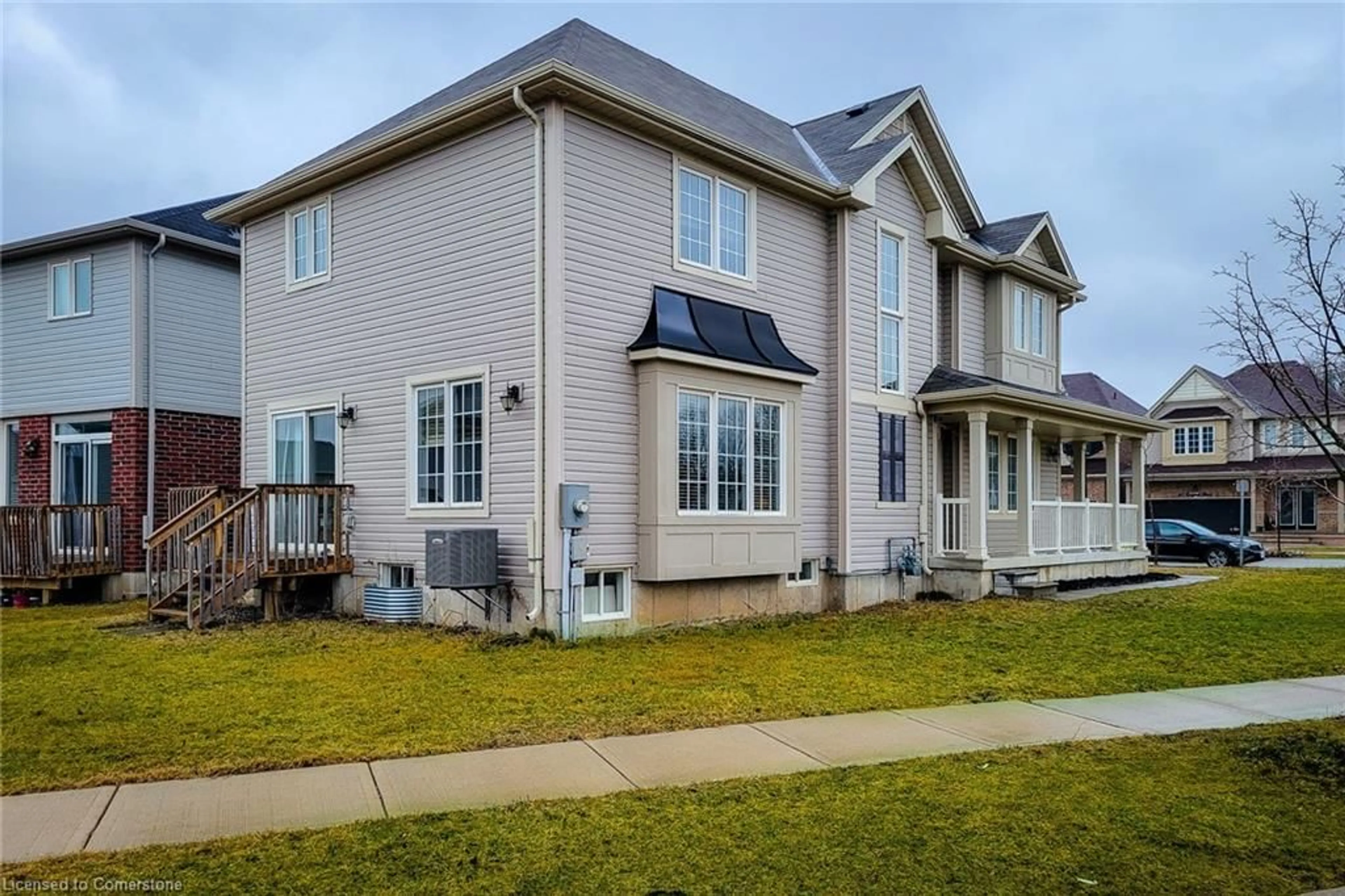 Home with vinyl exterior material, street for 64 Longboat Run, Brantford Ontario N3T 0P8