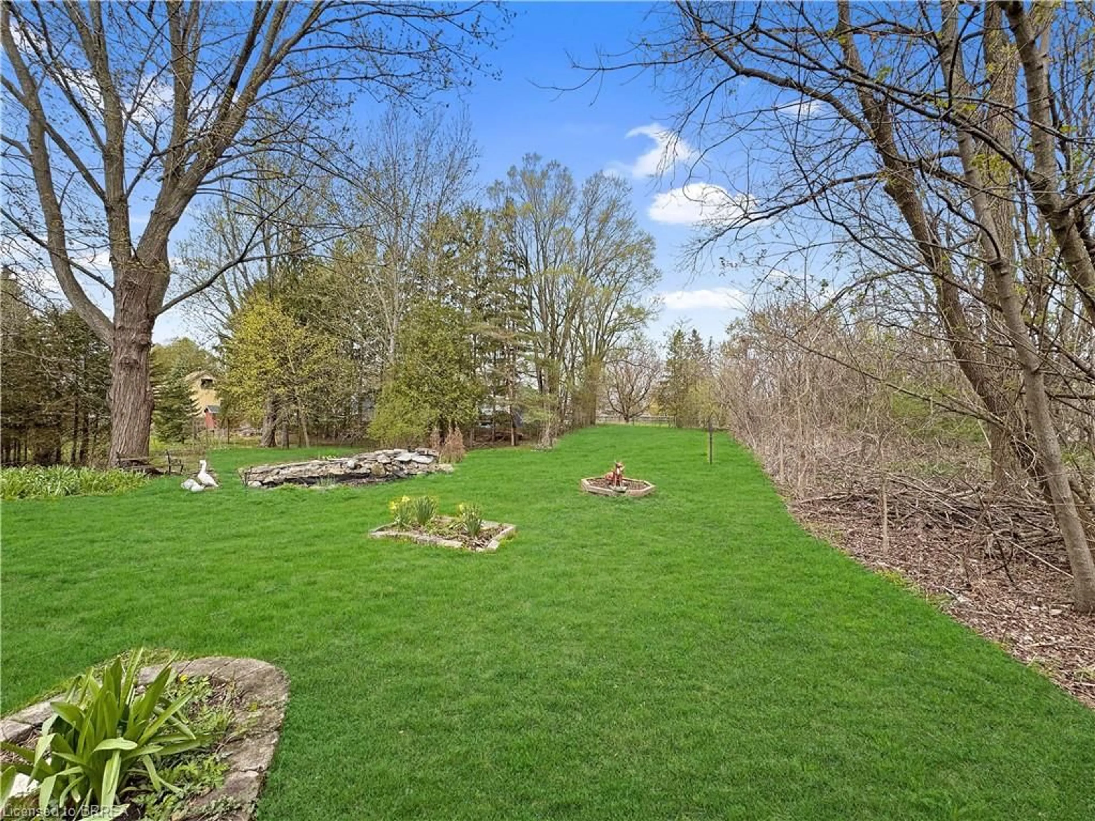 A pic from outside/outdoor area/front of a property/back of a property/a pic from drone, forest/trees view for 135 Birkett Lane, Brantford Ontario N3T 5L9