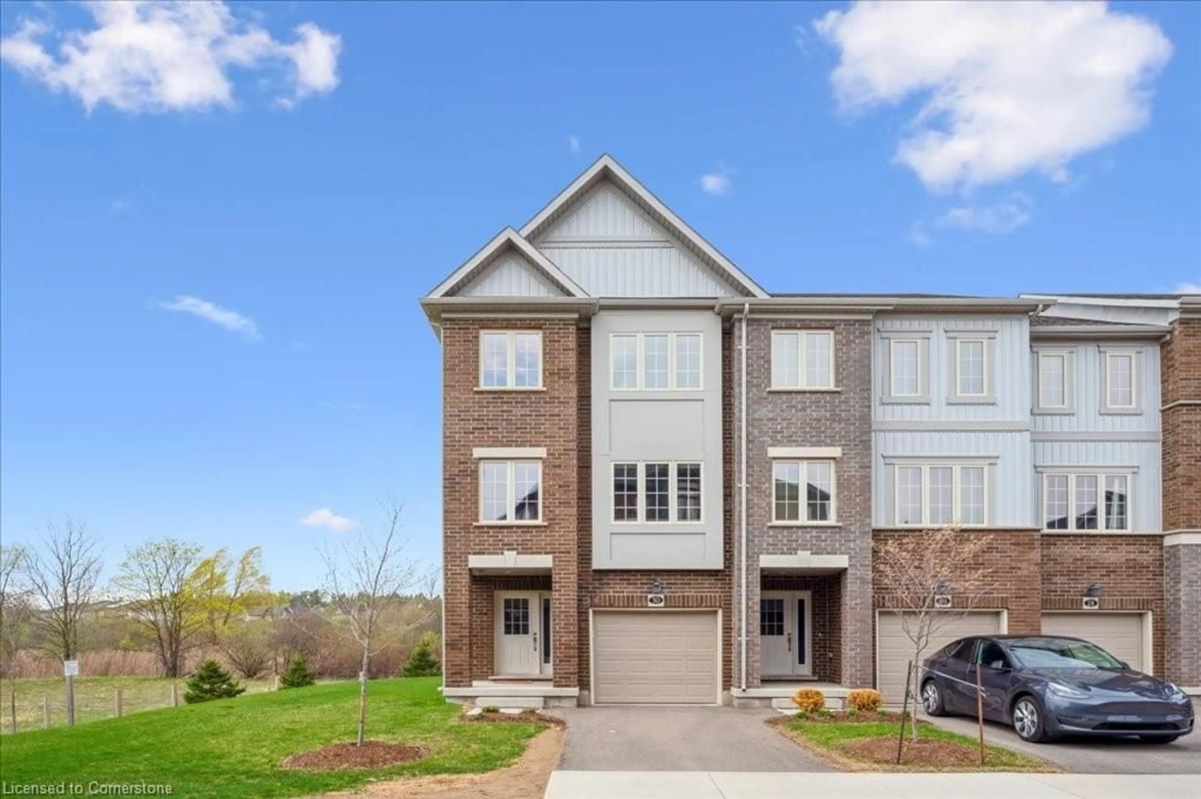 Home with brick exterior material, street for 311 Woolwich St #30, Waterloo Ontario N2K 0H4
