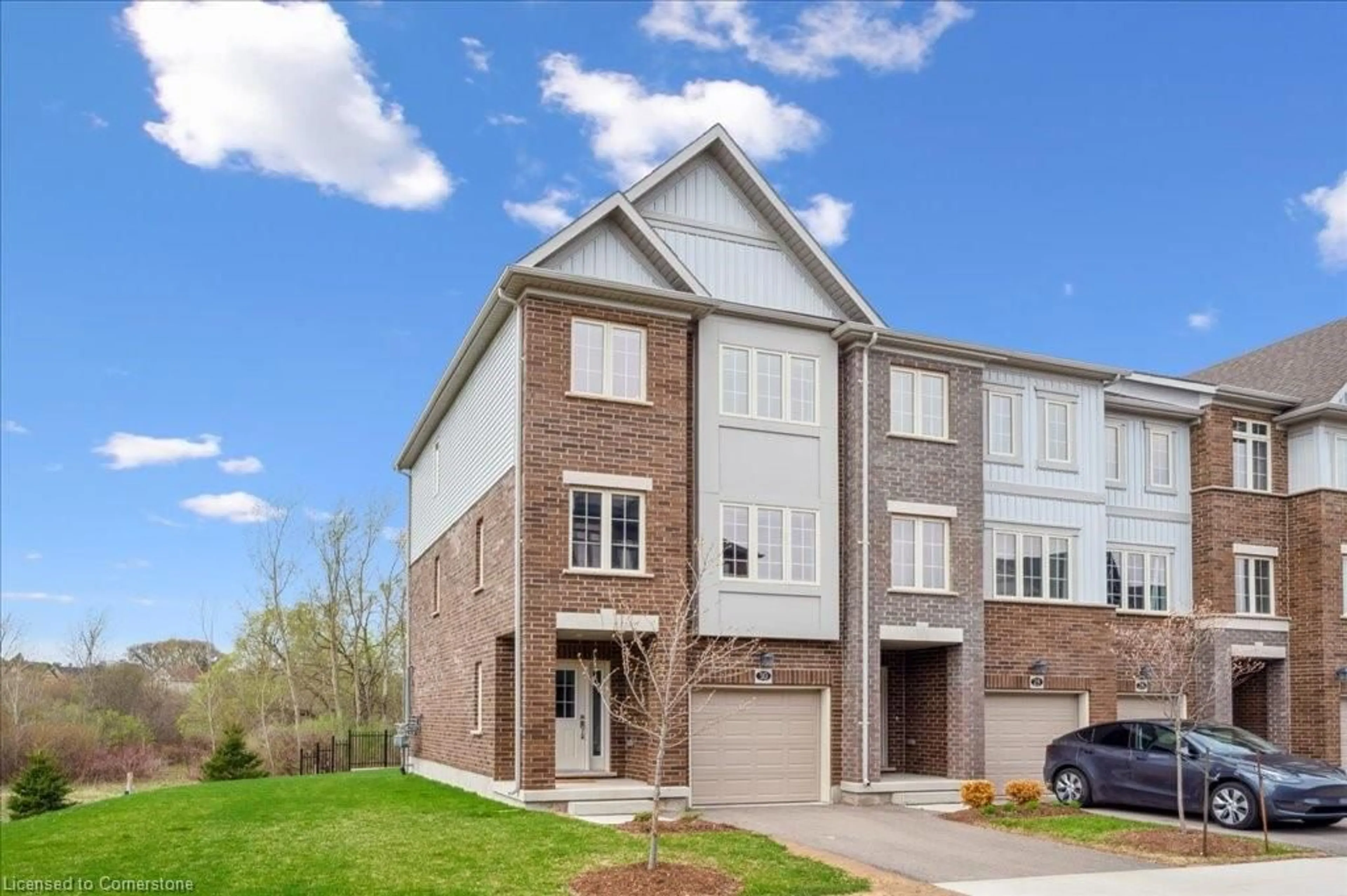 Home with brick exterior material, street for 311 Woolwich St #30, Waterloo Ontario N2K 0H4