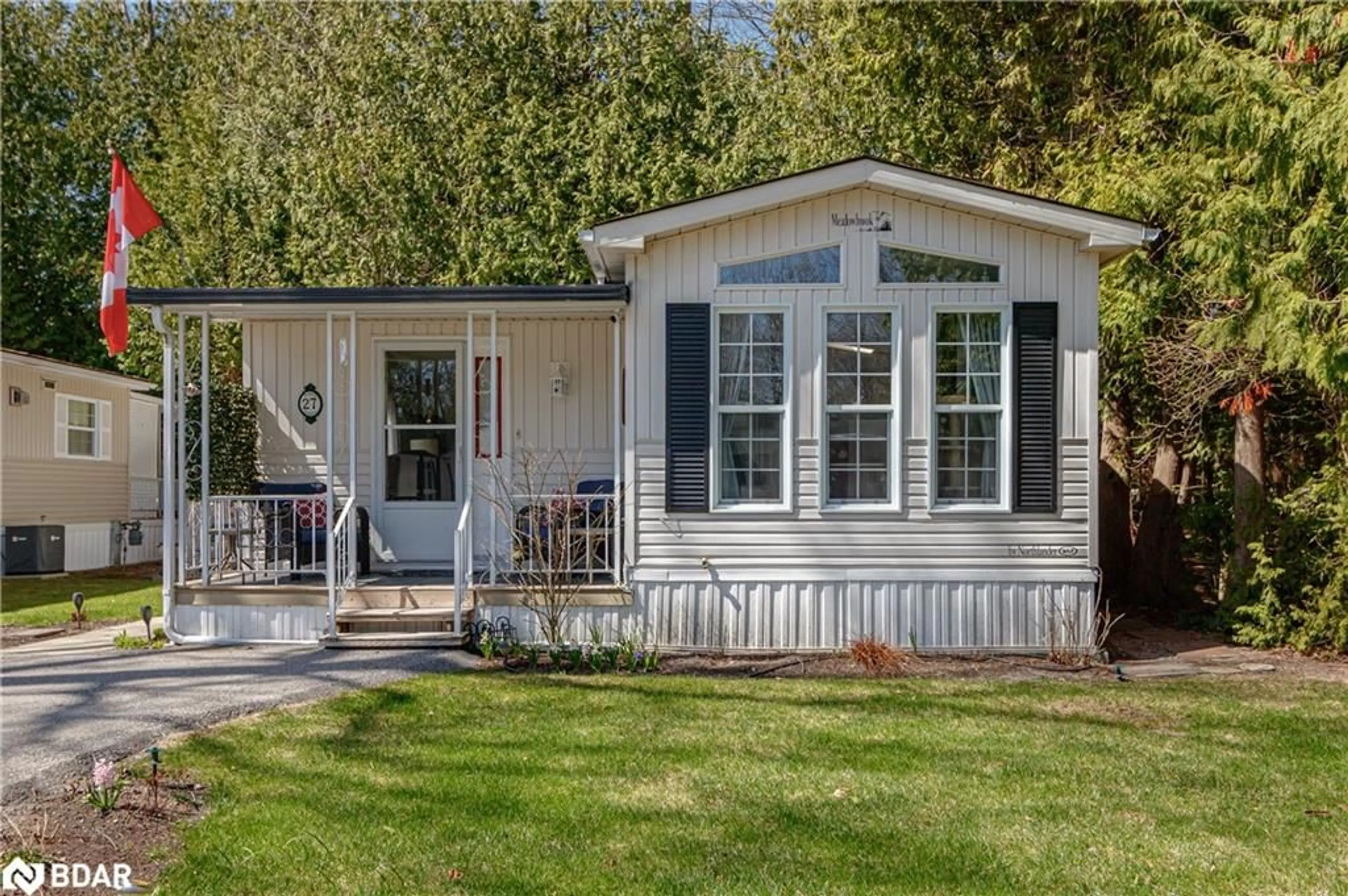 Home with vinyl exterior material, street for 27 The Boardwalk, Wasaga Beach Ontario L9Z 3A8