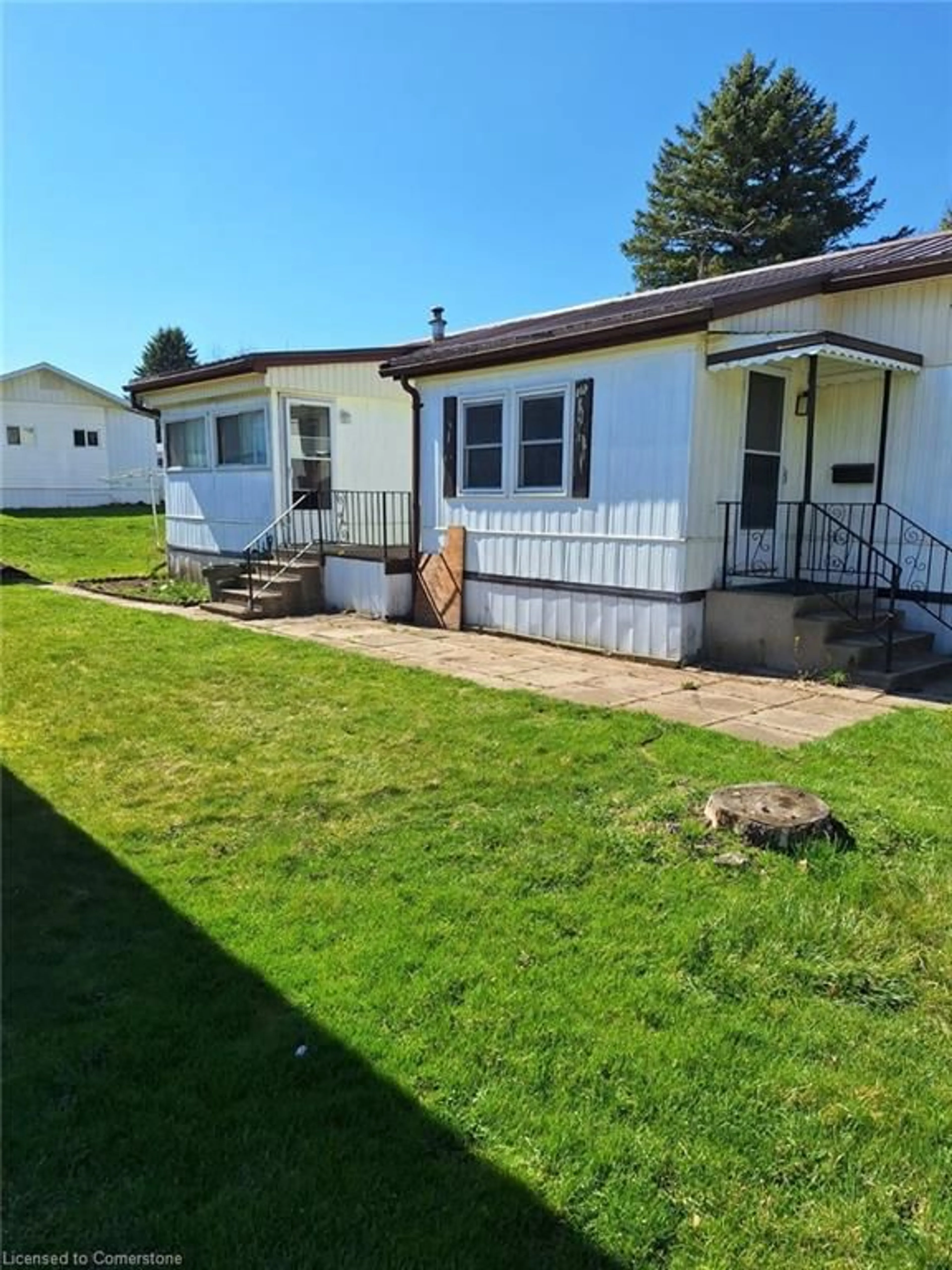 A pic from outside/outdoor area/front of a property/back of a property/a pic from drone, street for 23 North St #D-13, Tillsonburg Ontario N4G 1B9