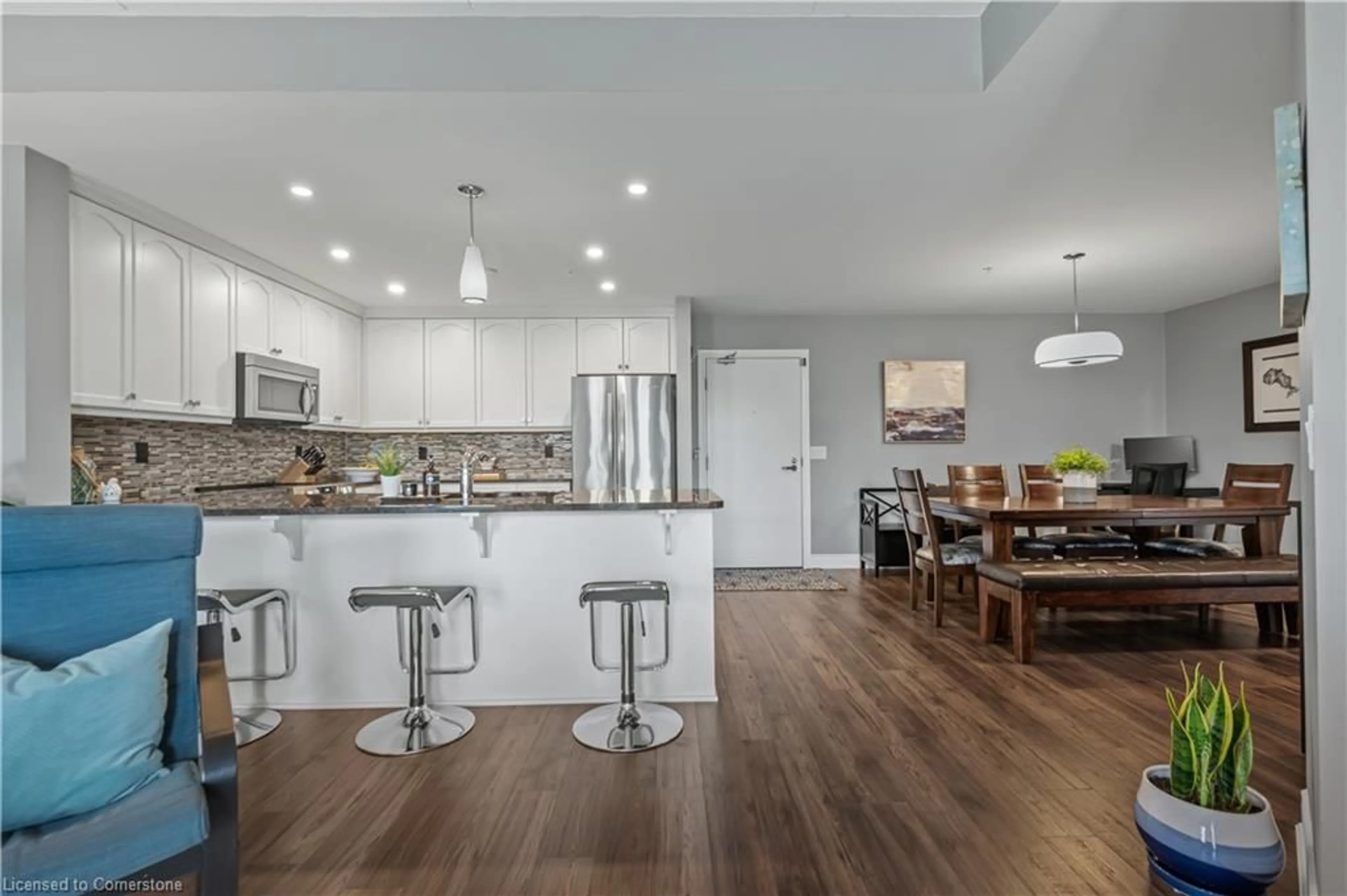Open concept kitchen, wood/laminate floor for 106 Bard Blvd #308, Guelph Ontario N1L 0L8