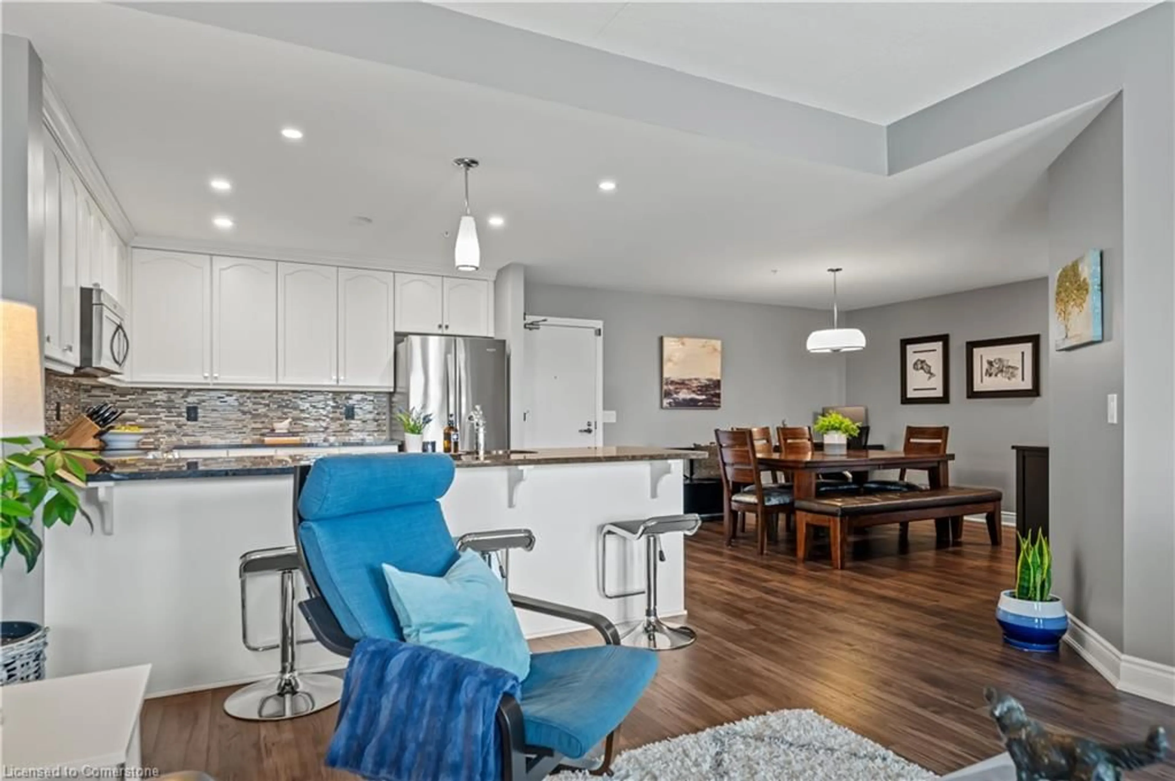 Open concept kitchen, wood/laminate floor for 106 Bard Blvd #308, Guelph Ontario N1L 0L8