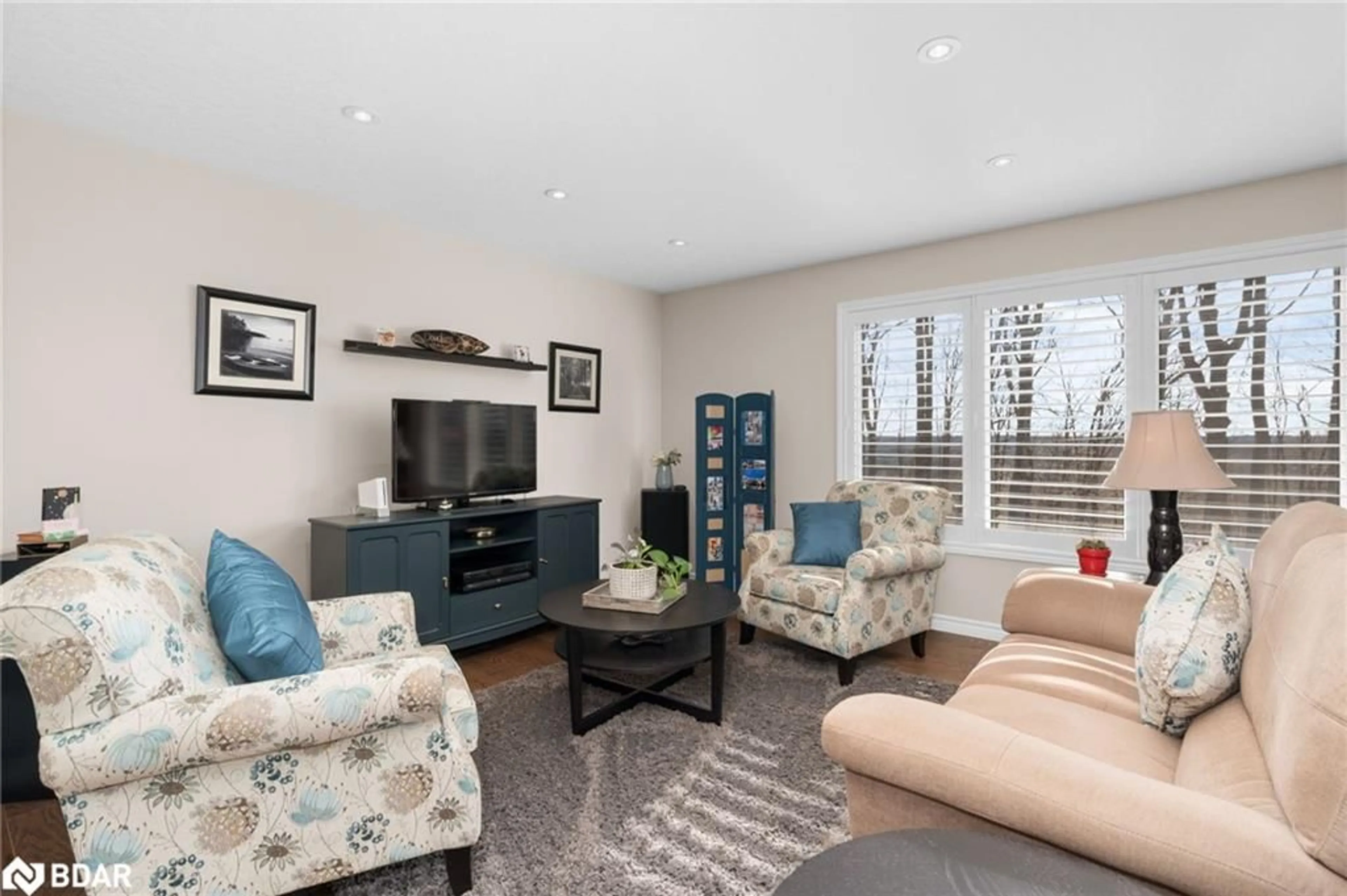 Living room with furniture, wood/laminate floor for 5305 Line 7 North, Oro-Medonte Ontario L0K 1N0