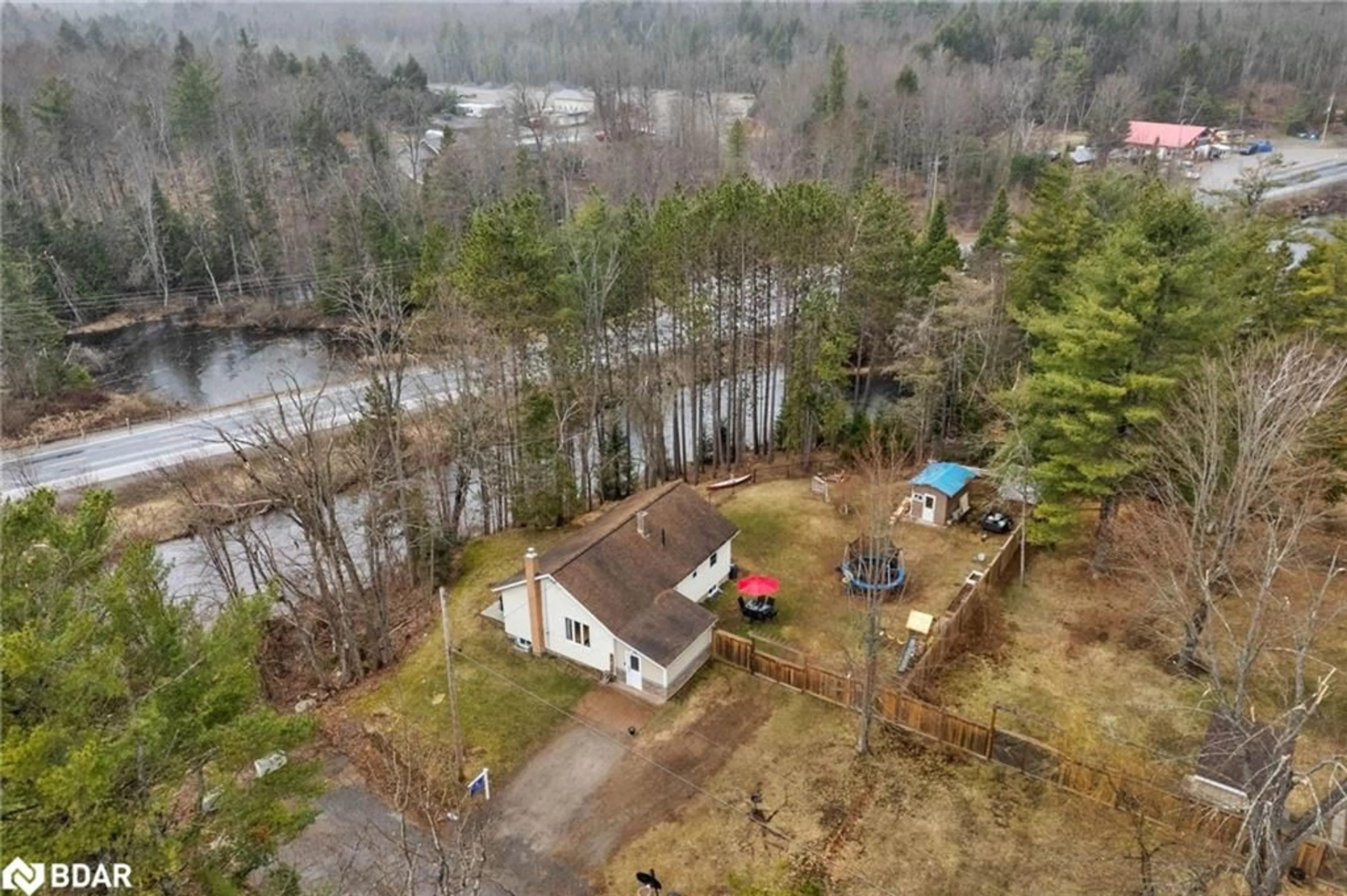 A pic from outside/outdoor area/front of a property/back of a property/a pic from drone, water/lake/river/ocean view for 58 River St, Apsley Ontario K0L 1A0