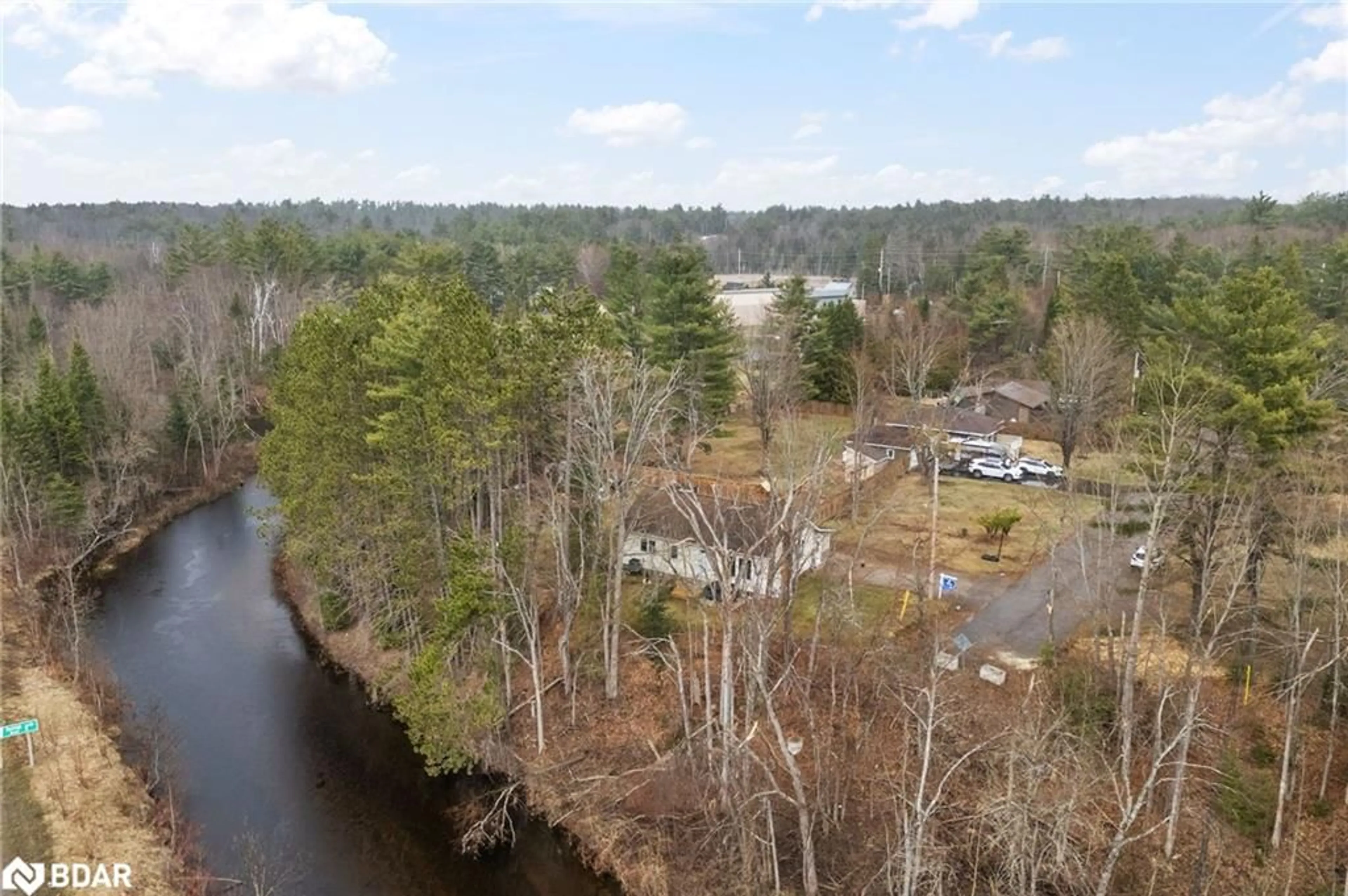A pic from outside/outdoor area/front of a property/back of a property/a pic from drone, water/lake/river/ocean view for 58 River St, Apsley Ontario K0L 1A0