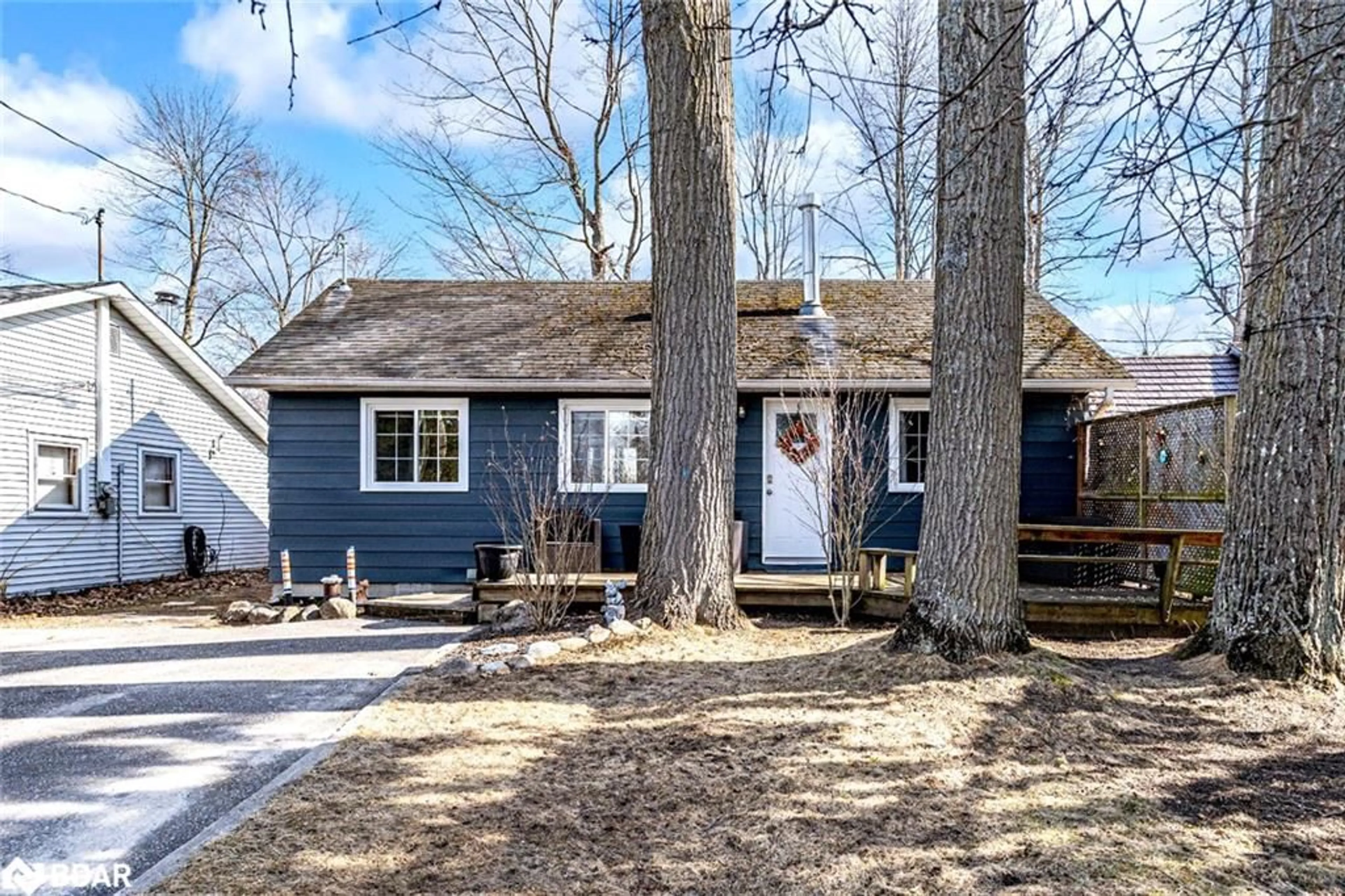 Home with vinyl exterior material, street for 1939 Tiny Beaches Rd, Tiny Ontario L0L 1P1