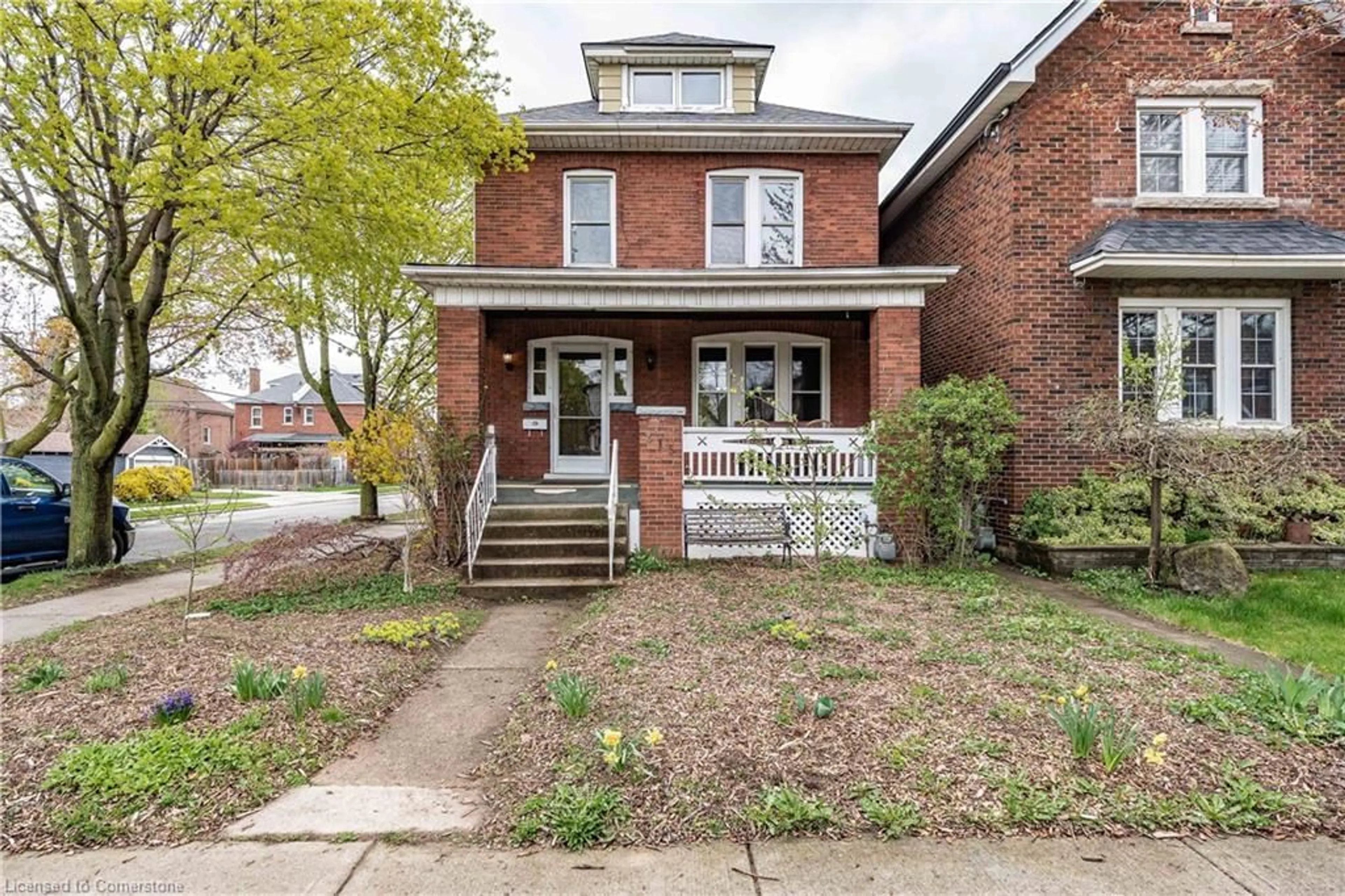 Home with brick exterior material, street for 215 London St, Hamilton Ontario L8K 2H1