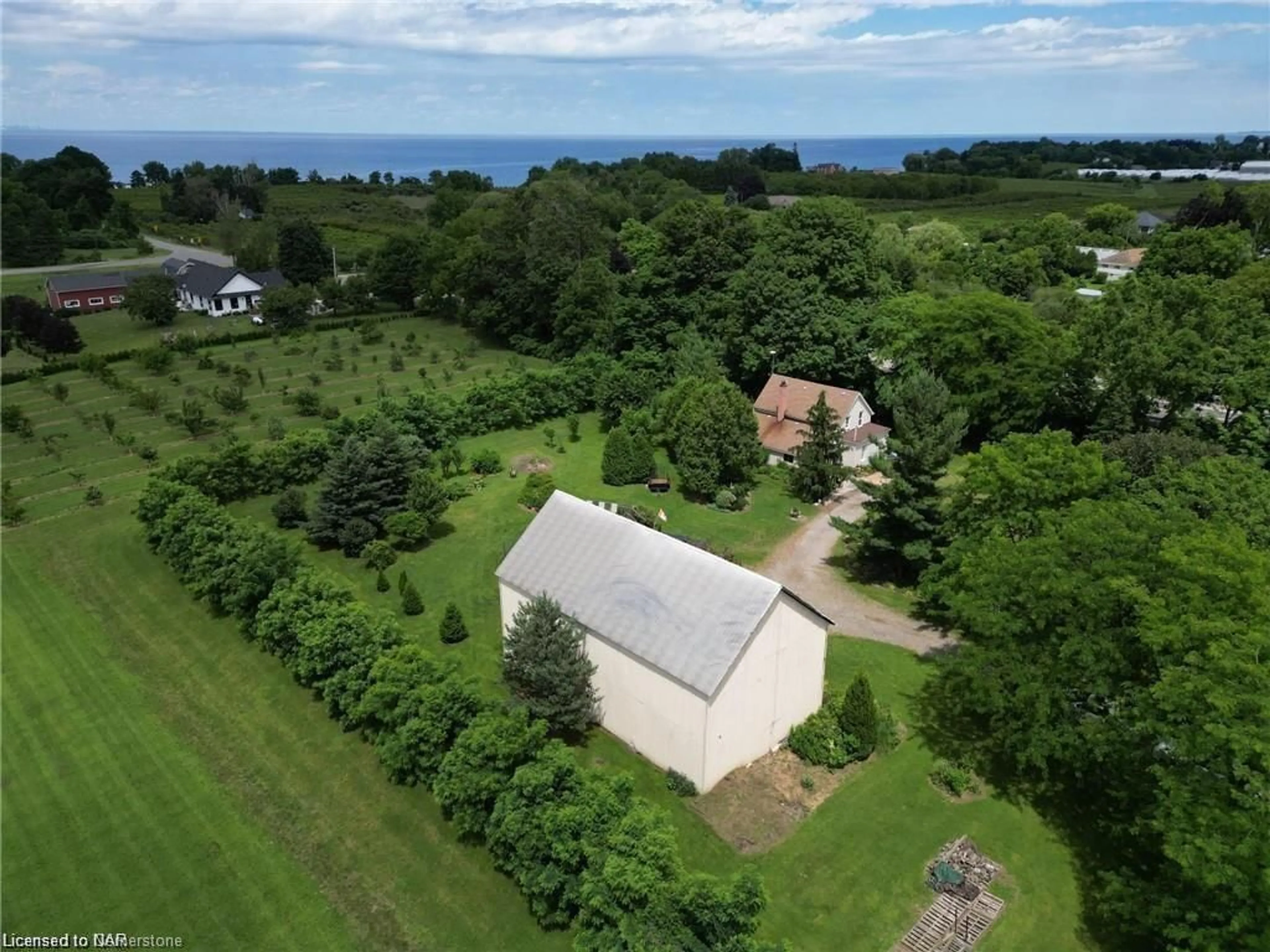 A pic from outside/outdoor area/front of a property/back of a property/a pic from drone, water/lake/river/ocean view for 5400 North Service Rd, Beamsville Ontario L0R 1B3