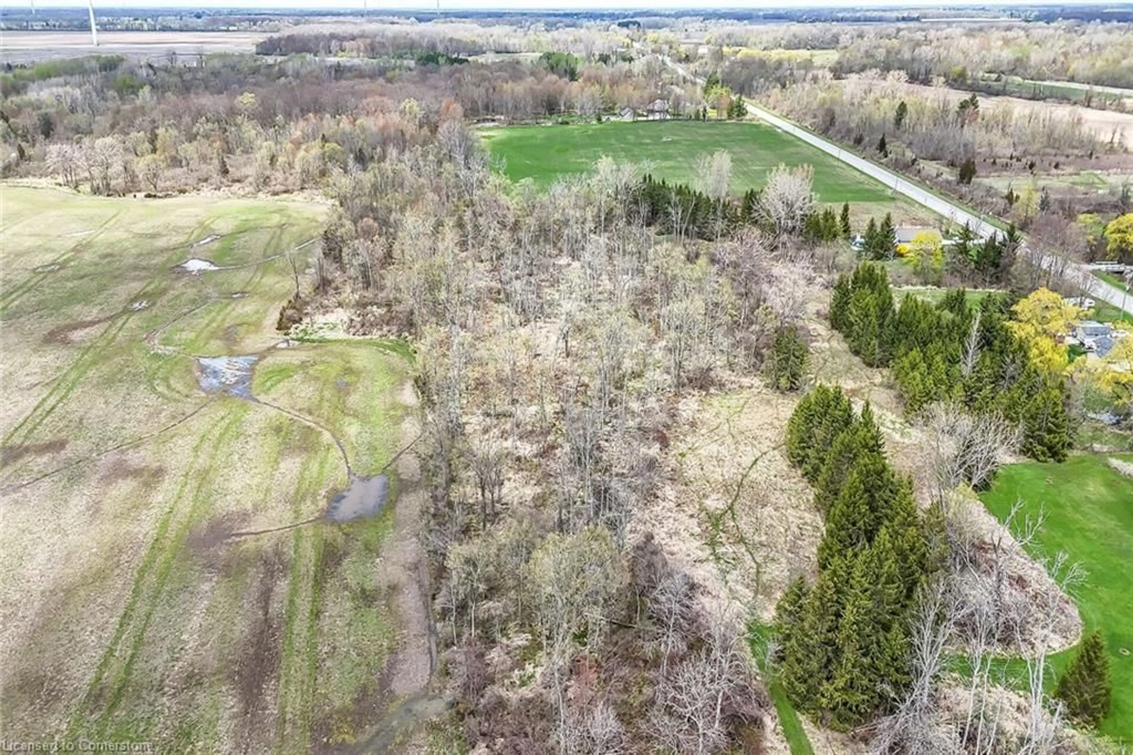 A pic from outside/outdoor area/front of a property/back of a property/a pic from drone, forest/trees view for 2779 North Shore Dr, Lowbanks Ontario N0A 1K0