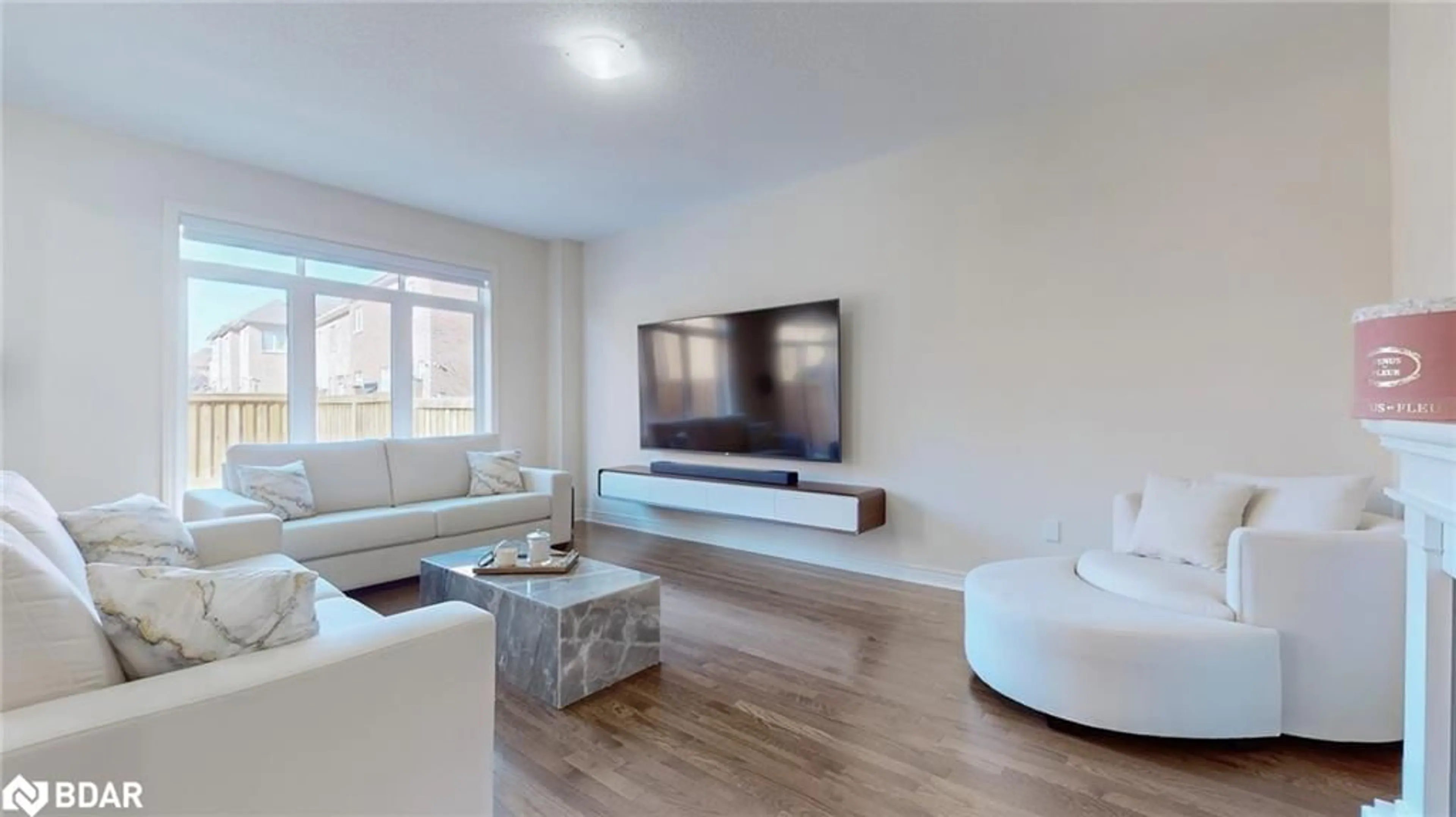 Living room with furniture, wood/laminate floor for 219 Inverness Way, Bradford West Gwillimbury Ontario L3Z 0X5