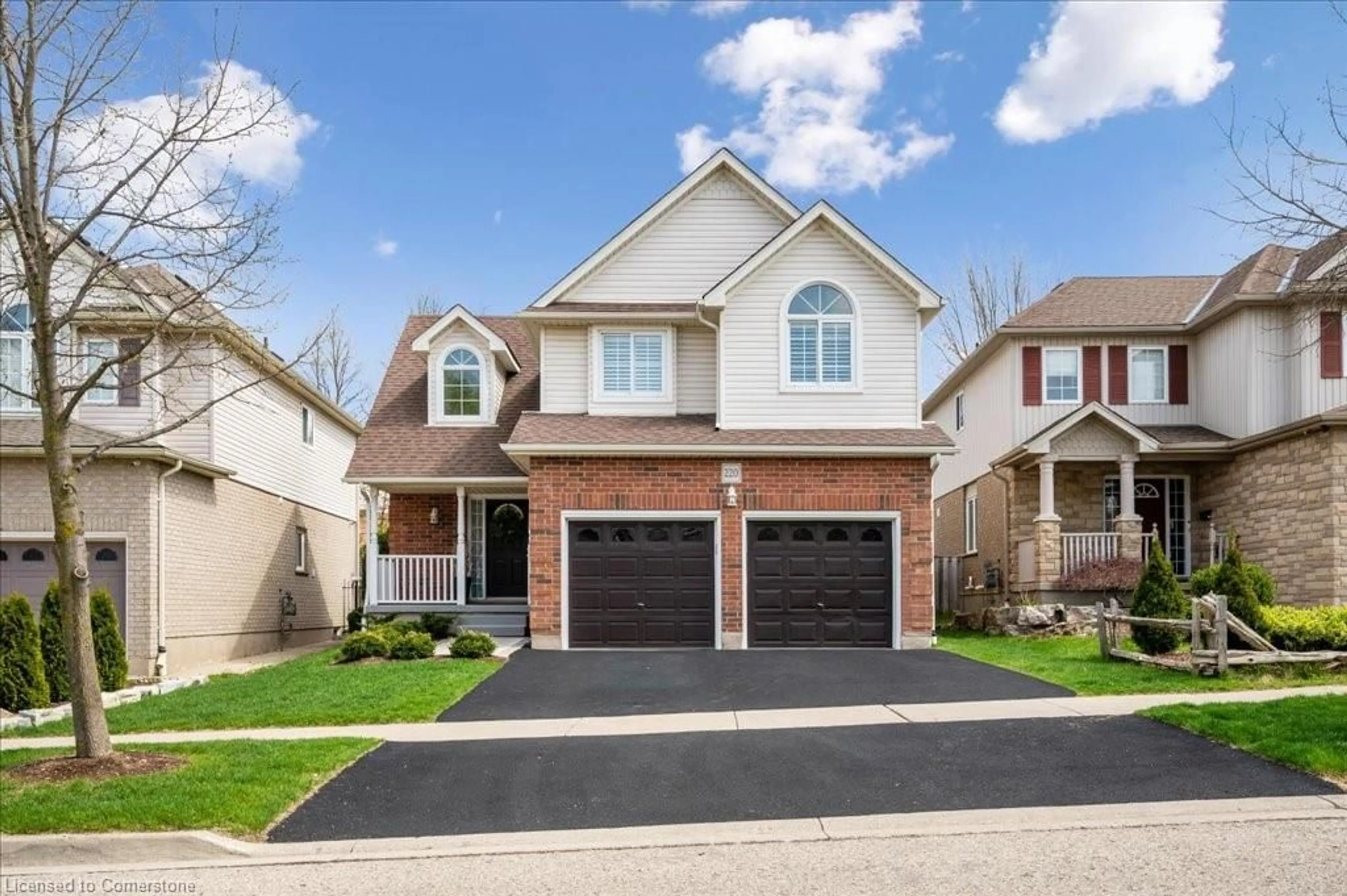 Home with brick exterior material, street for 220 Doon South Dr, Kitchener Ontario N2P 2L8