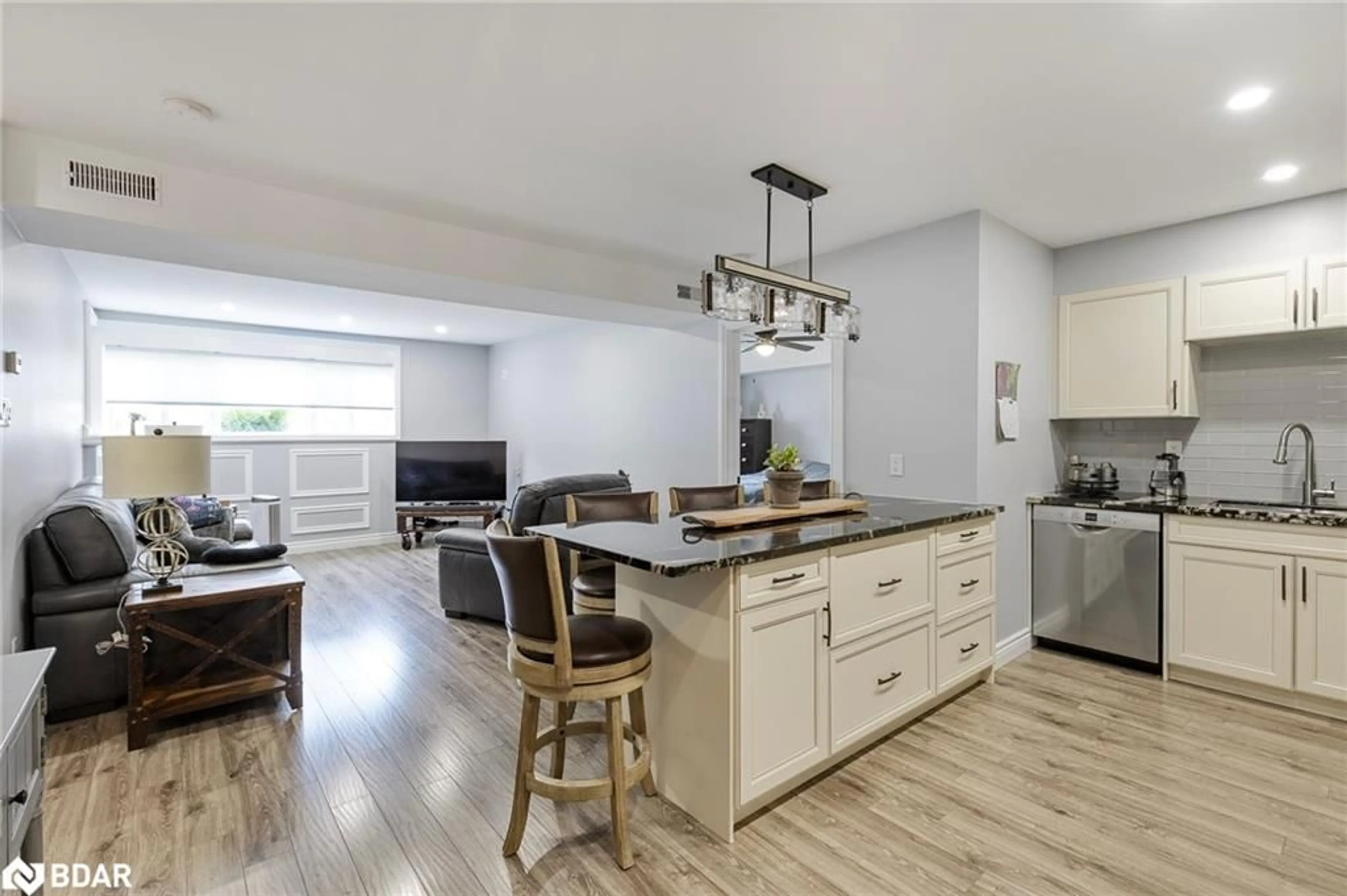 Open concept kitchen, wood/laminate floor for 126 Bell Farm Rd #B08, Barrie Ontario L4M 6J3