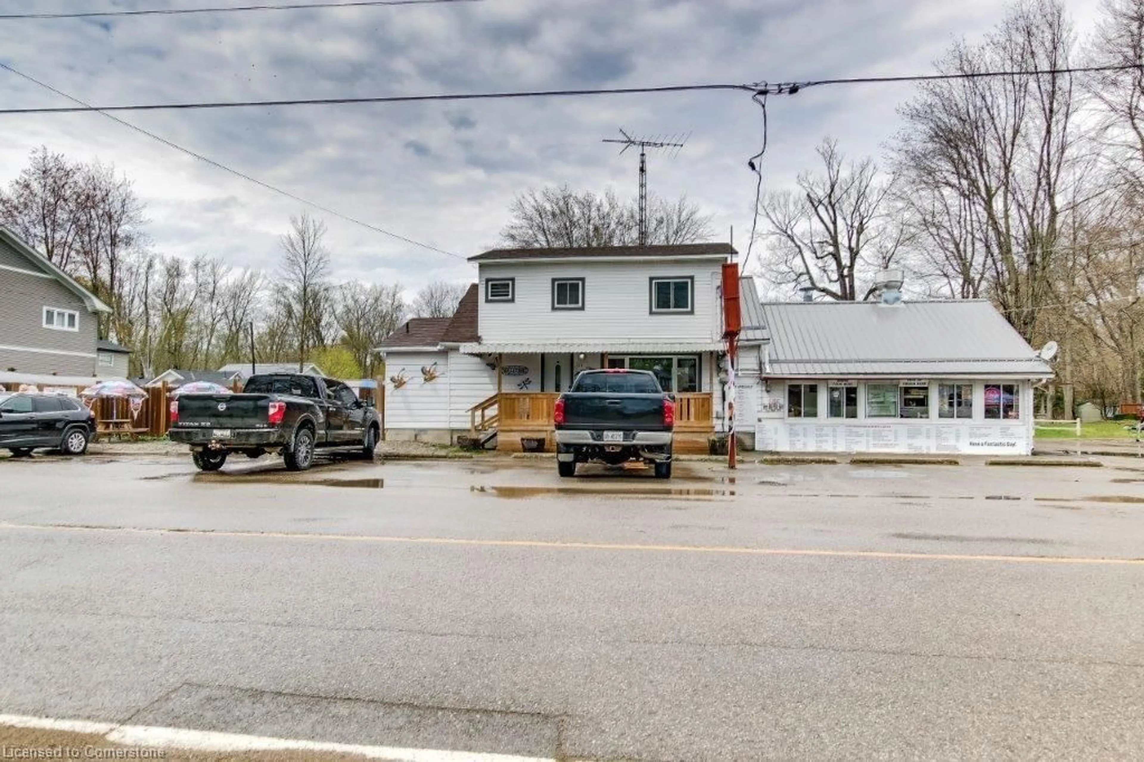 A pic from outside/outdoor area/front of a property/back of a property/a pic from drone, street for 259 Cedar Dr, Turkey Point Ontario N0E 1T0