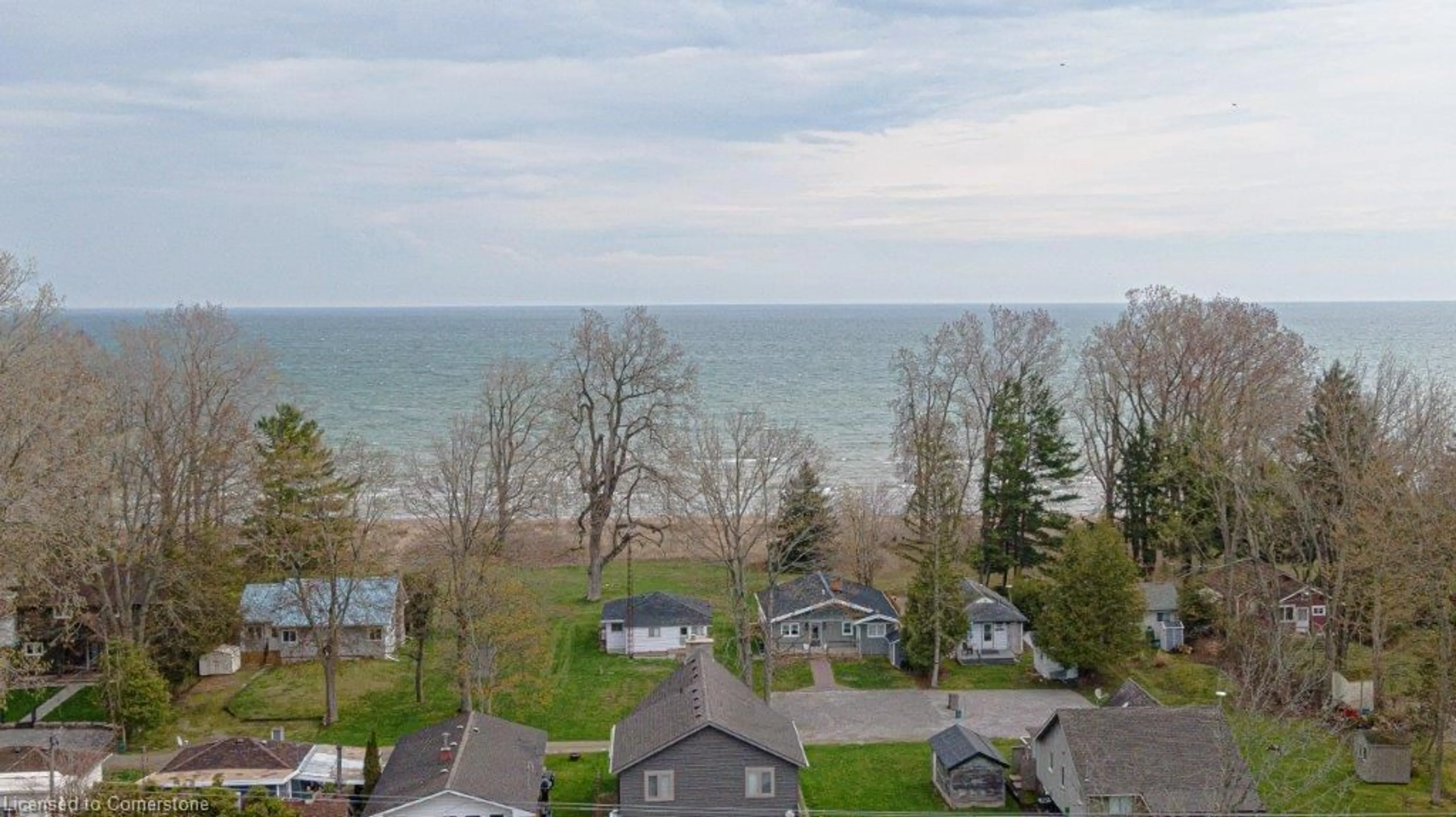 A pic from outside/outdoor area/front of a property/back of a property/a pic from drone, water/lake/river/ocean view for 259 Cedar Dr, Turkey Point Ontario N0E 1T0