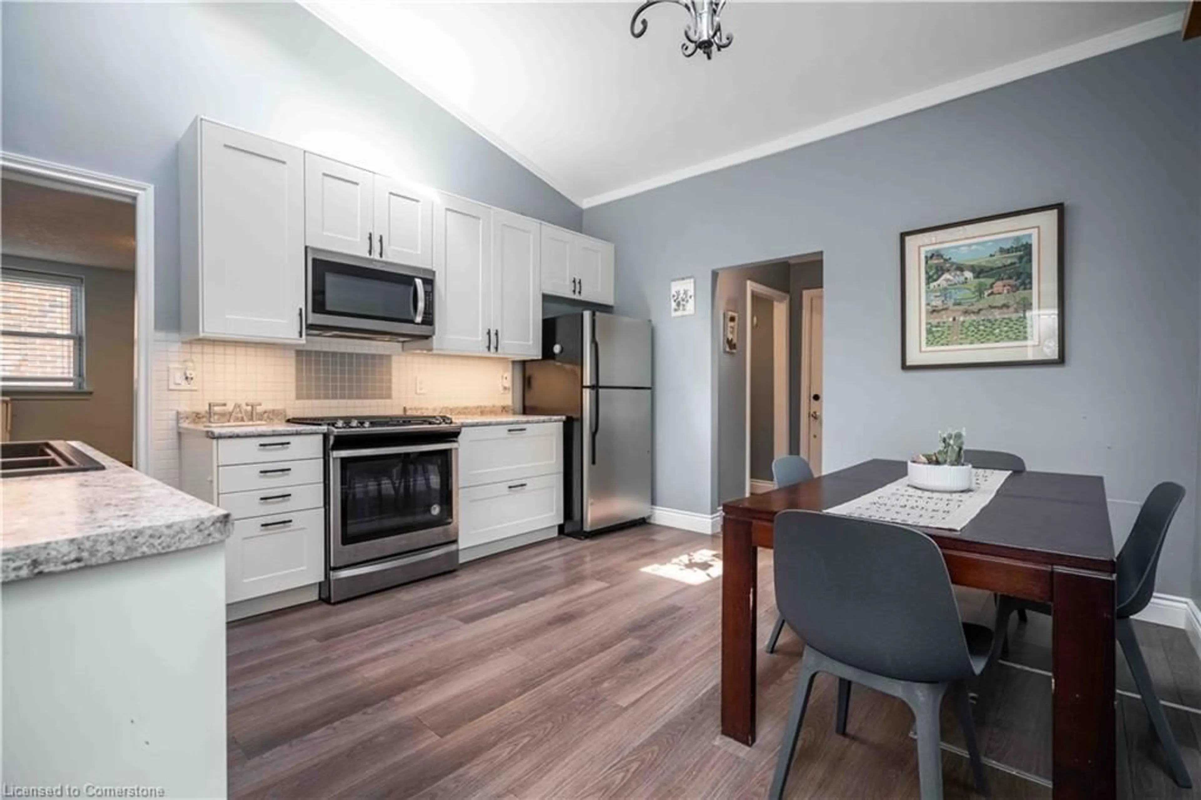 Open concept kitchen, wood/laminate floor for 173 Grand River Ave, Brantford Ontario N3T 4X7