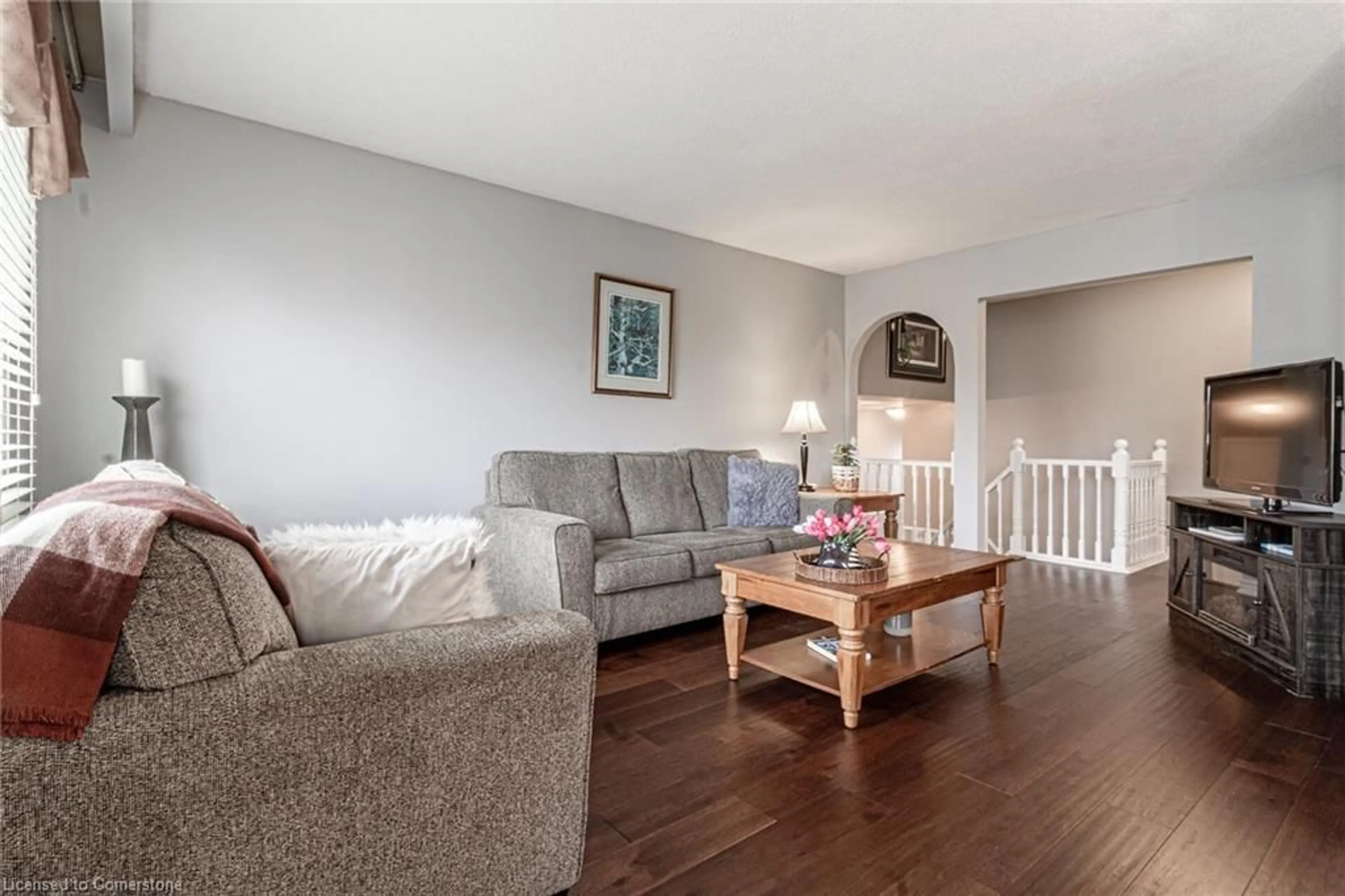 Living room with furniture, wood/laminate floor for 700 Woodview Rd, Burlington Ontario L7N 3A5