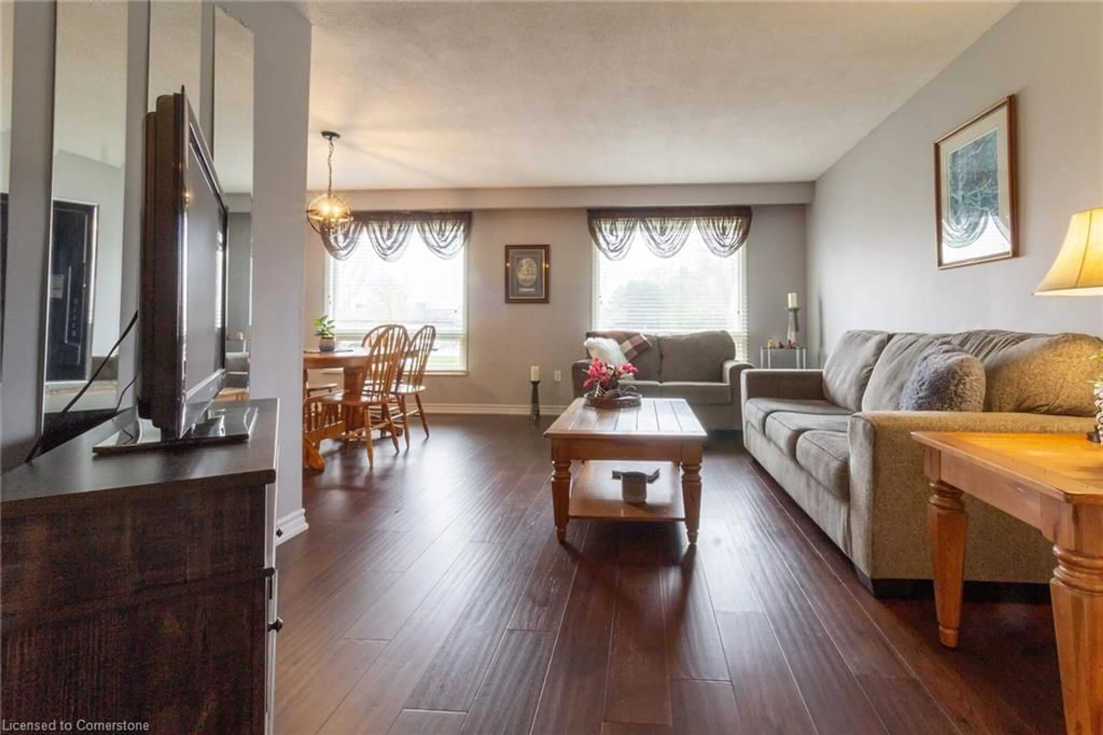 Living room with furniture, wood/laminate floor for 700 Woodview Rd, Burlington Ontario L7N 3A5