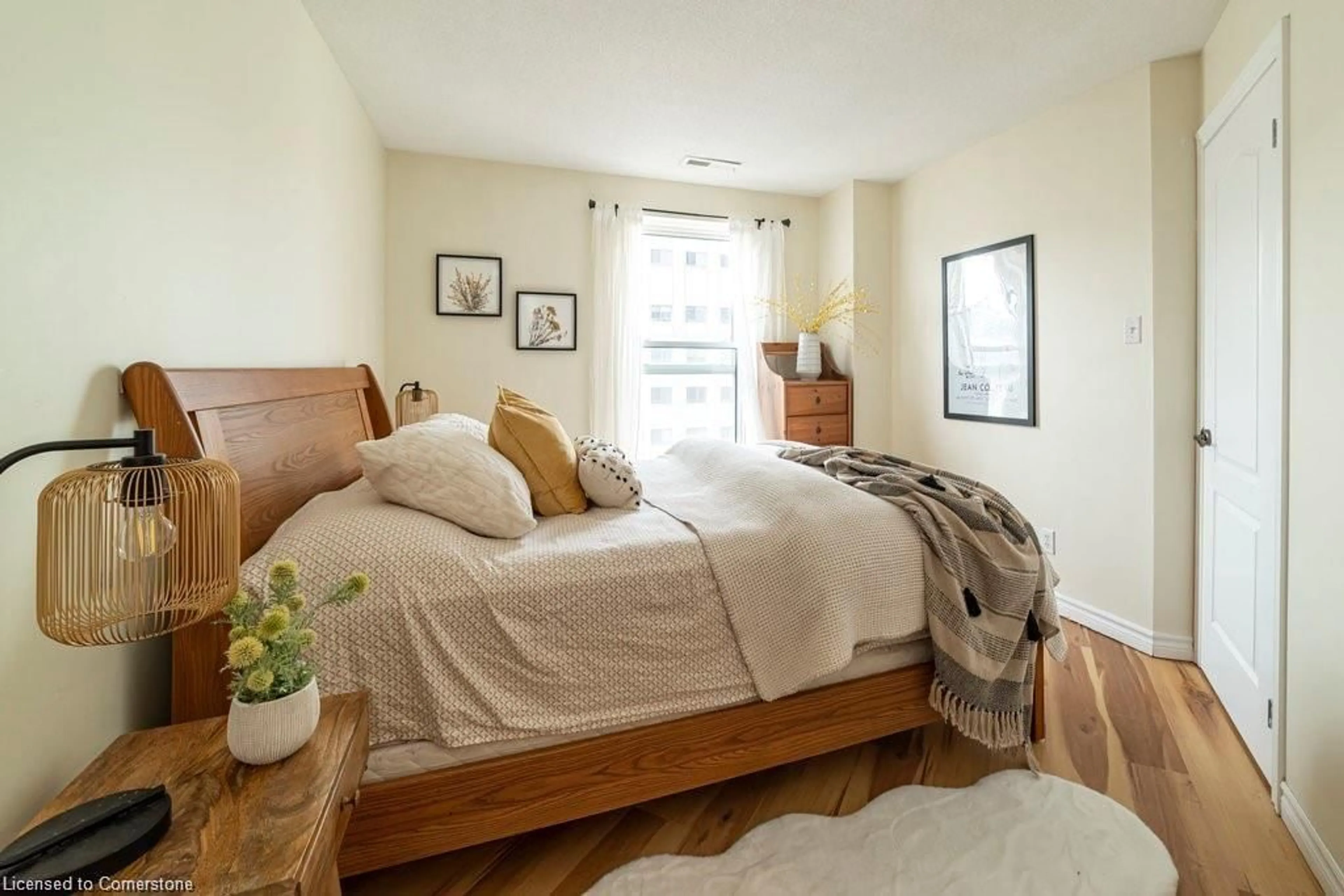 Bedroom with bed, unknown for 135 James St #1112, Hamilton Ontario L8P 2Z6