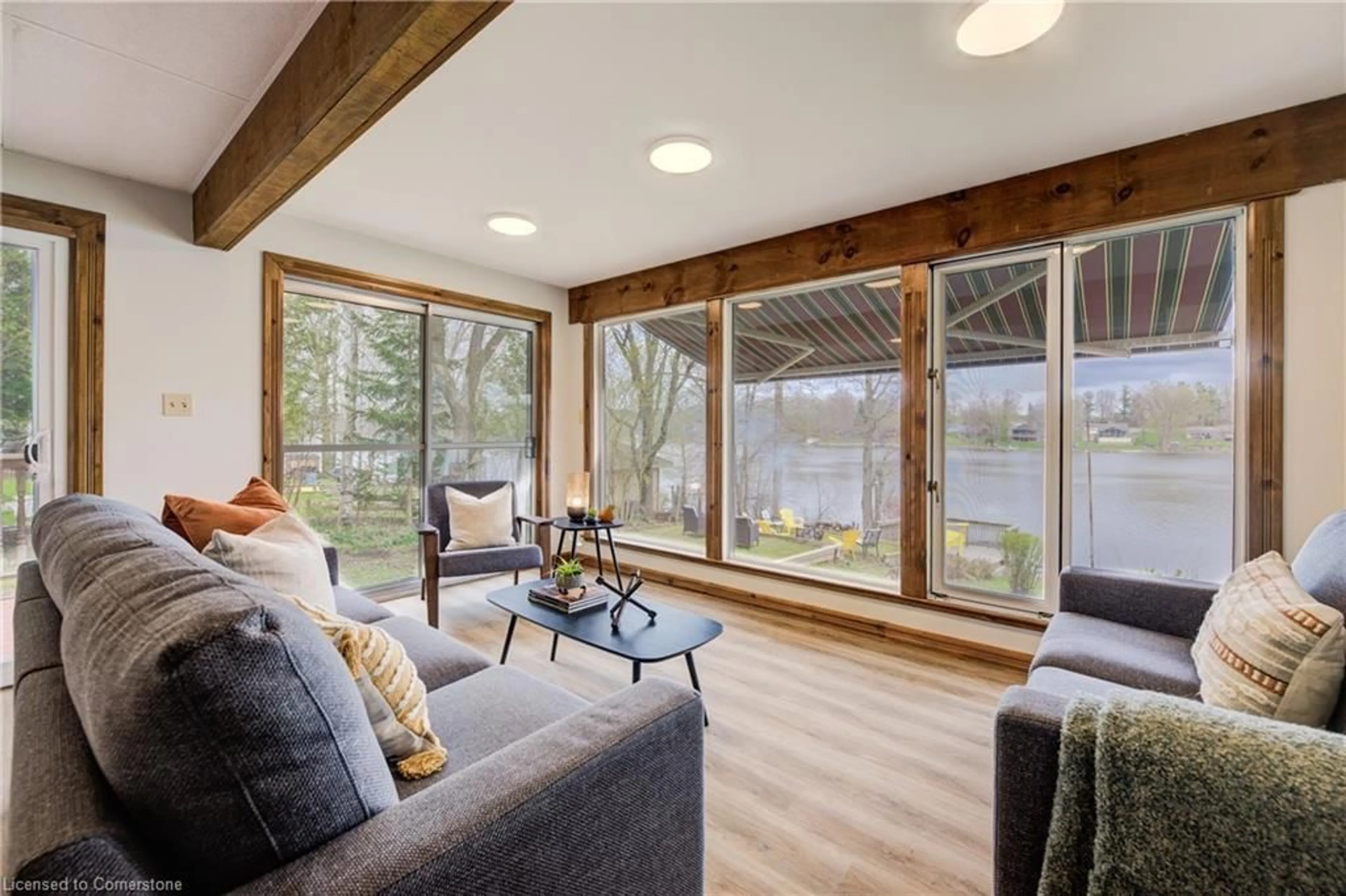Living room with furniture, wood/laminate floor for 448 Road 4, Conestogo Lake Ontario N0G 1P0