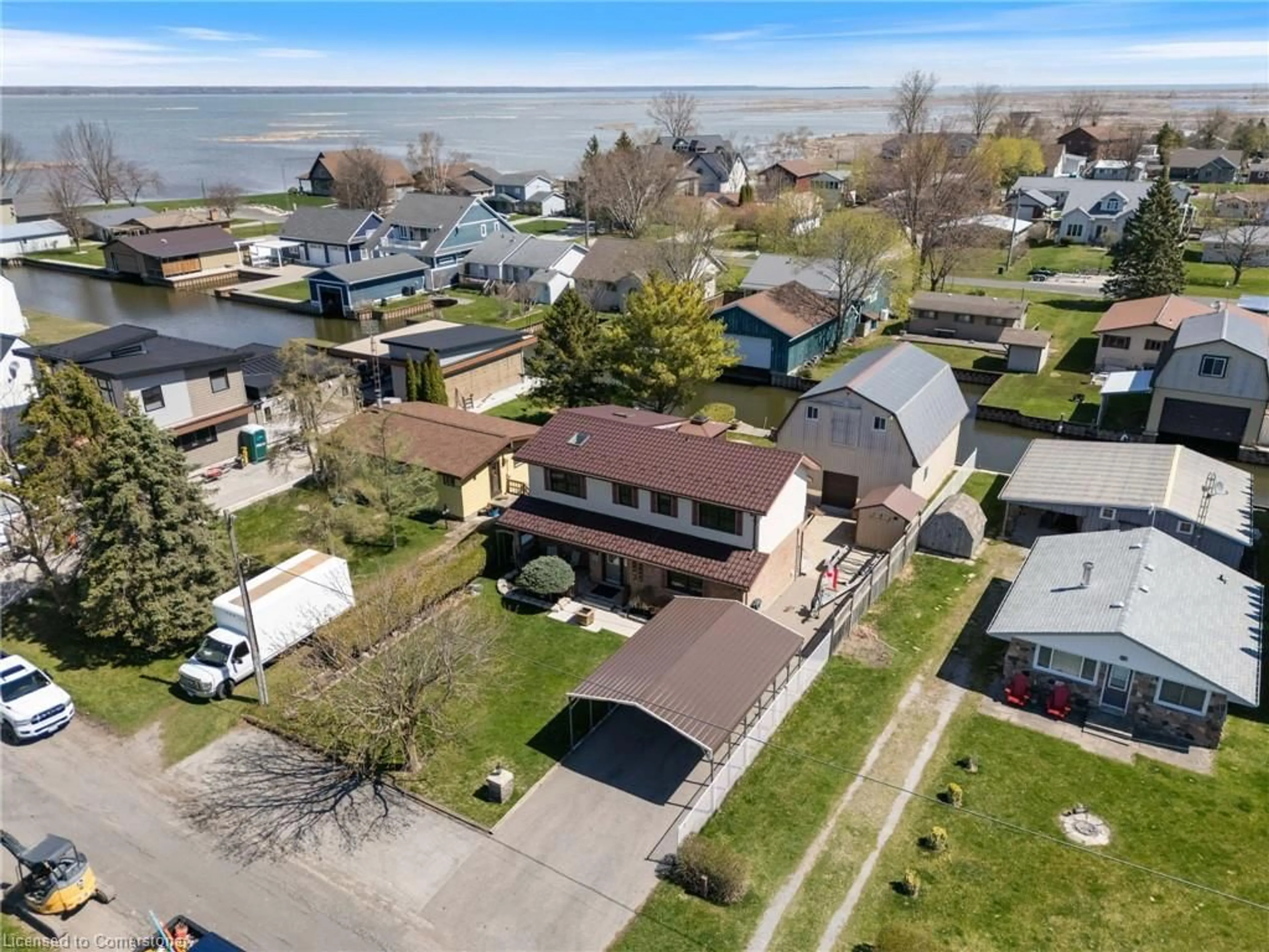 A pic from outside/outdoor area/front of a property/back of a property/a pic from drone, water/lake/river/ocean view for 23 Poplar Rd, Long Point Ontario N0E 1M0