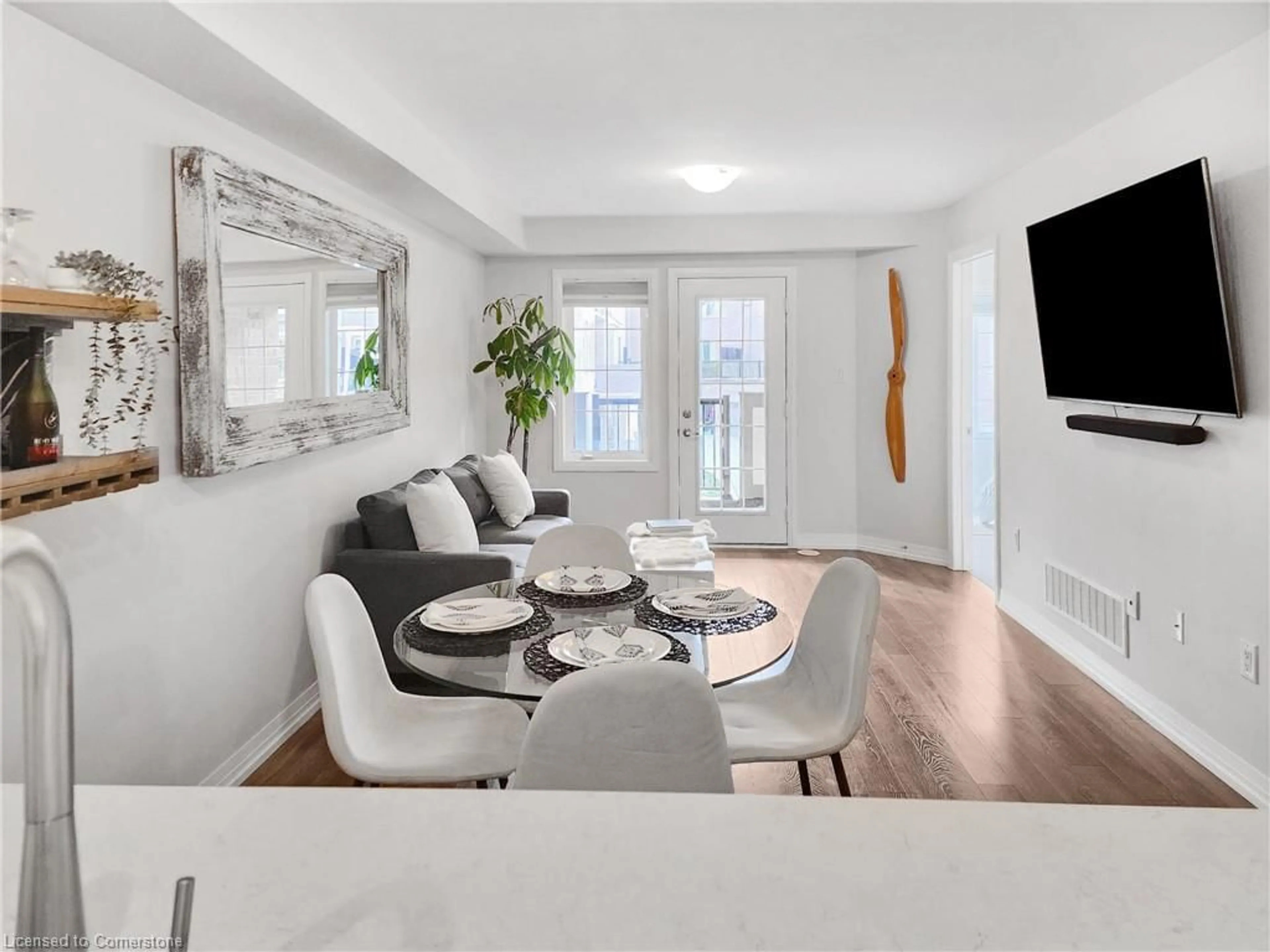 Living room with furniture, wood/laminate floor for 504 Buckeye Crt, Milton Ontario L9T 7E7
