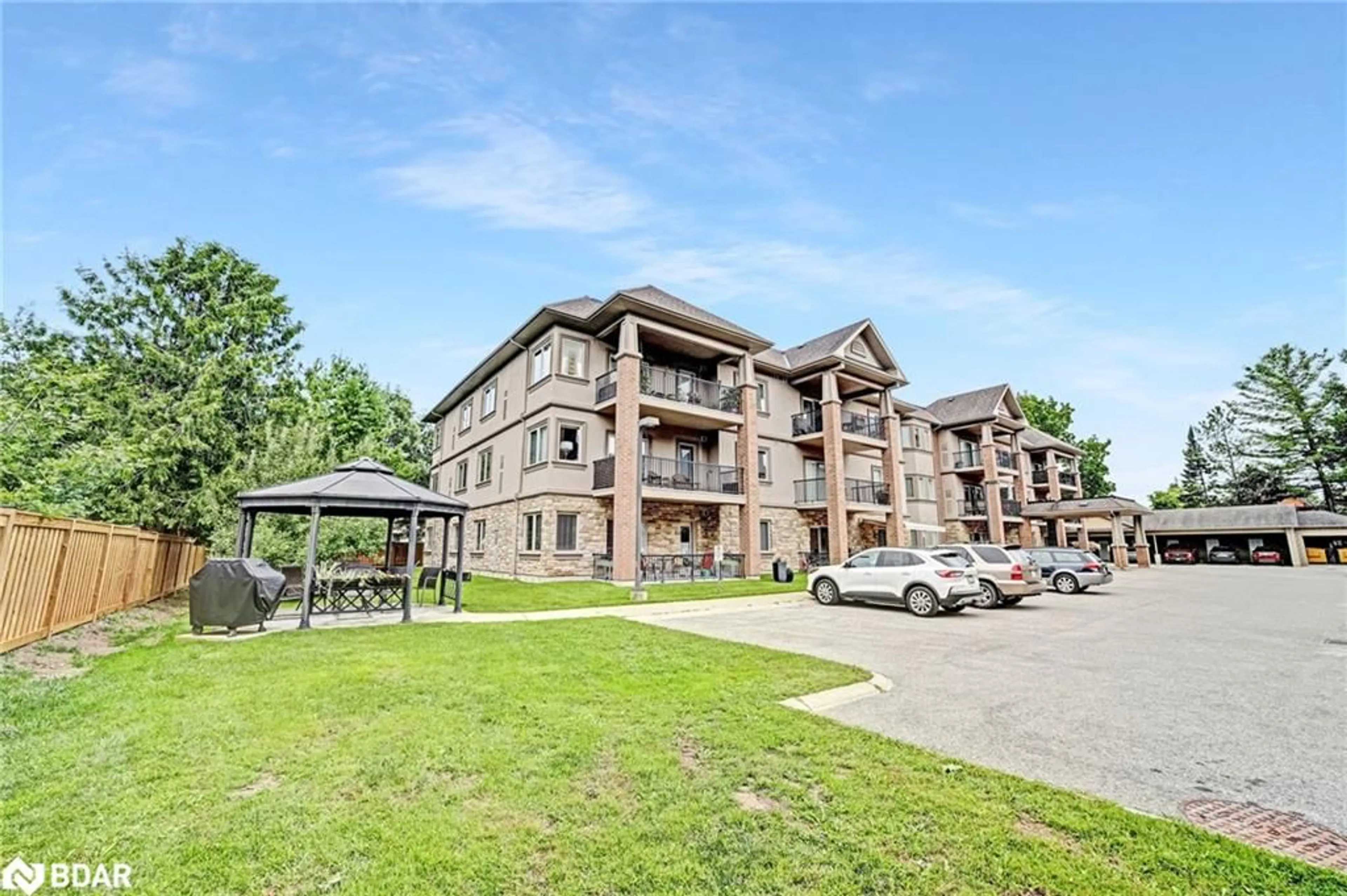 A pic from outside/outdoor area/front of a property/back of a property/a pic from drone, unknown for 19B Yonge St #103, Springwater Ontario L0L 1P0