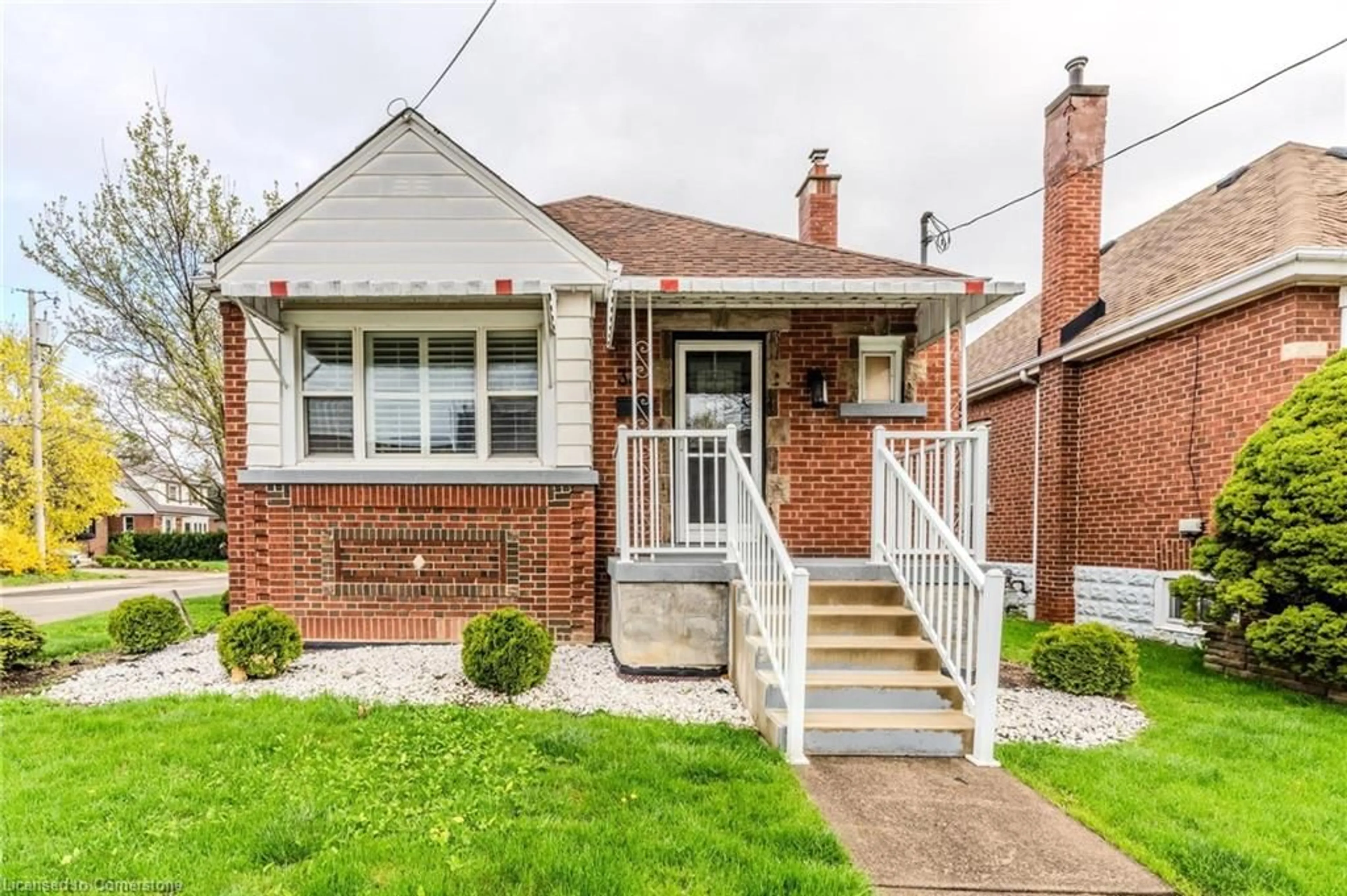 Home with brick exterior material, street for 33 Brucedale Ave, Hamilton Ontario L9A 1N1