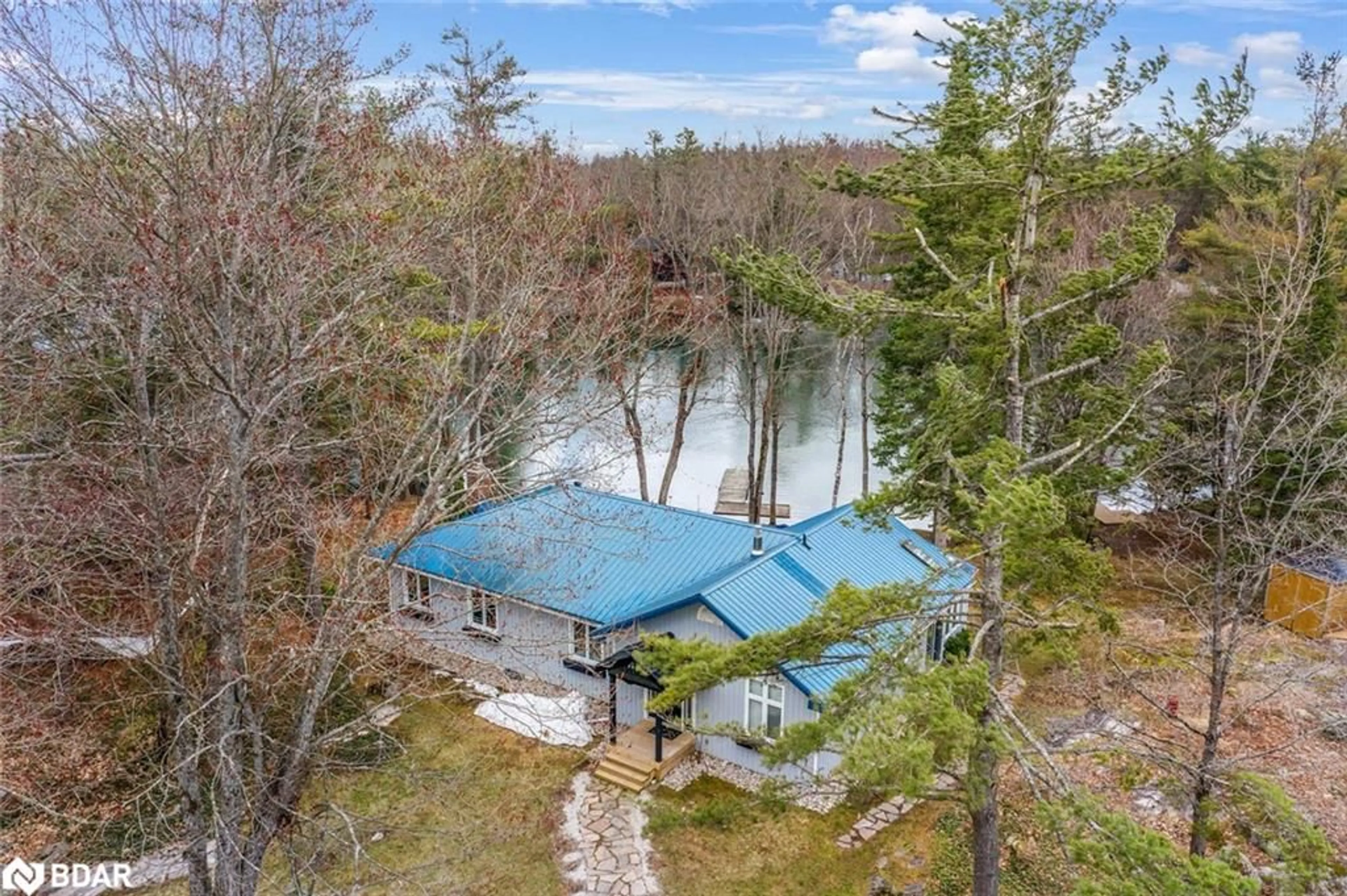 A pic from outside/outdoor area/front of a property/back of a property/a pic from drone, water/lake/river/ocean view for 3183 Green River Drive, Washago Ontario L0K 2B0