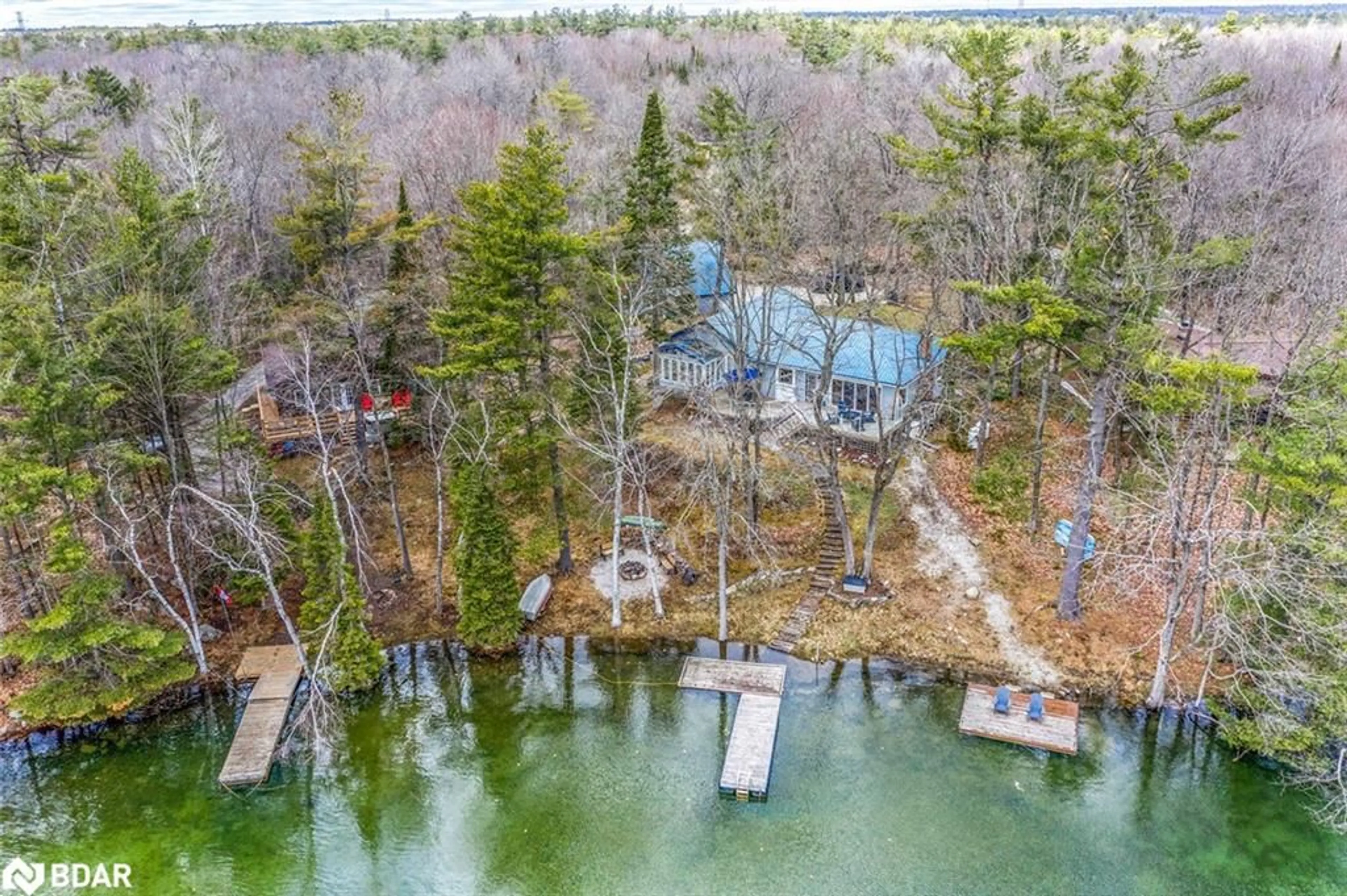 A pic from outside/outdoor area/front of a property/back of a property/a pic from drone, water/lake/river/ocean view for 3183 Green River Drive, Washago Ontario L0K 2B0