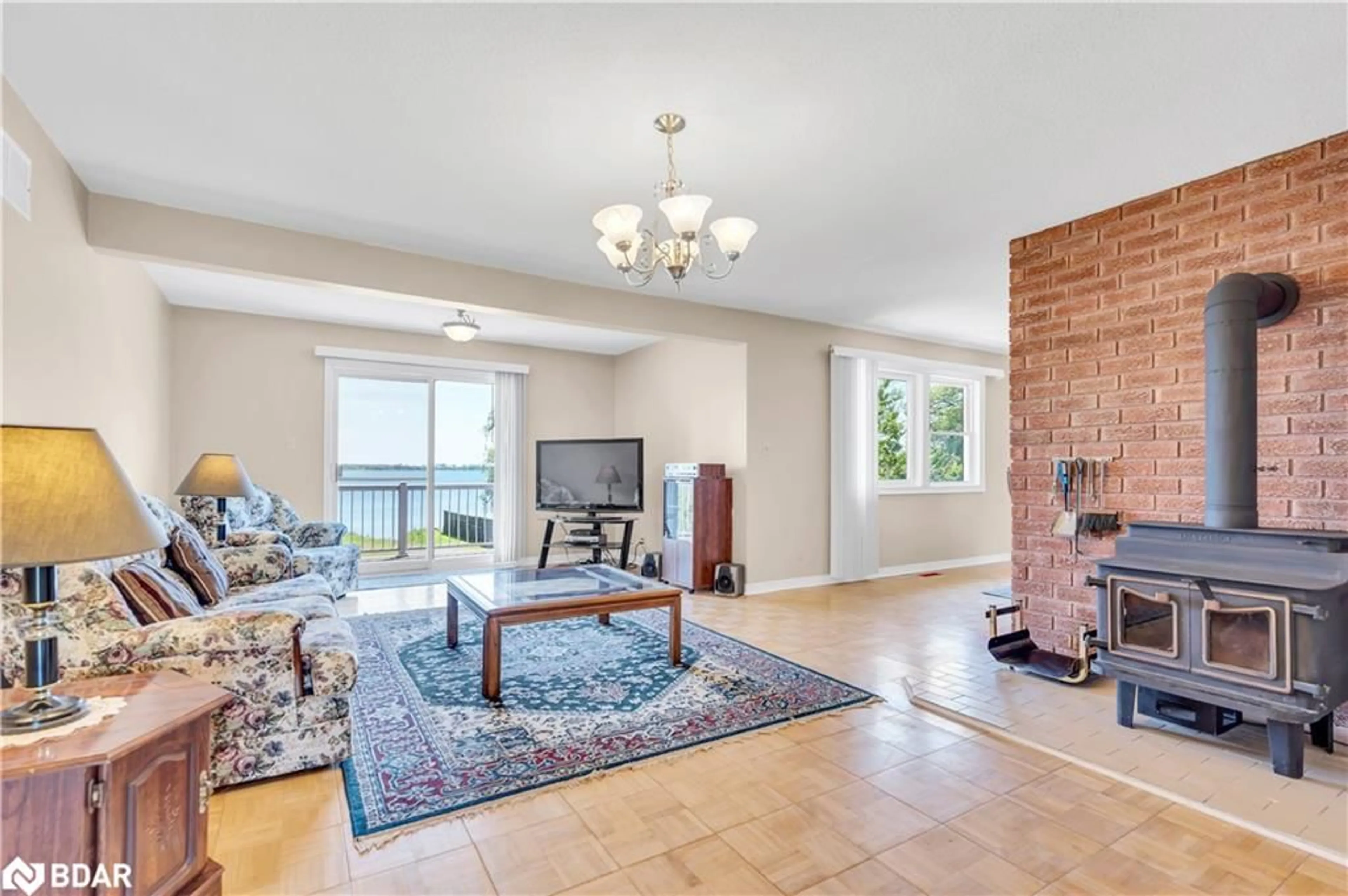 Living room with furniture, ceramic/tile floor for 132 Hiscock Shores Rd, Ameliasburgh Ontario K0K 1L0