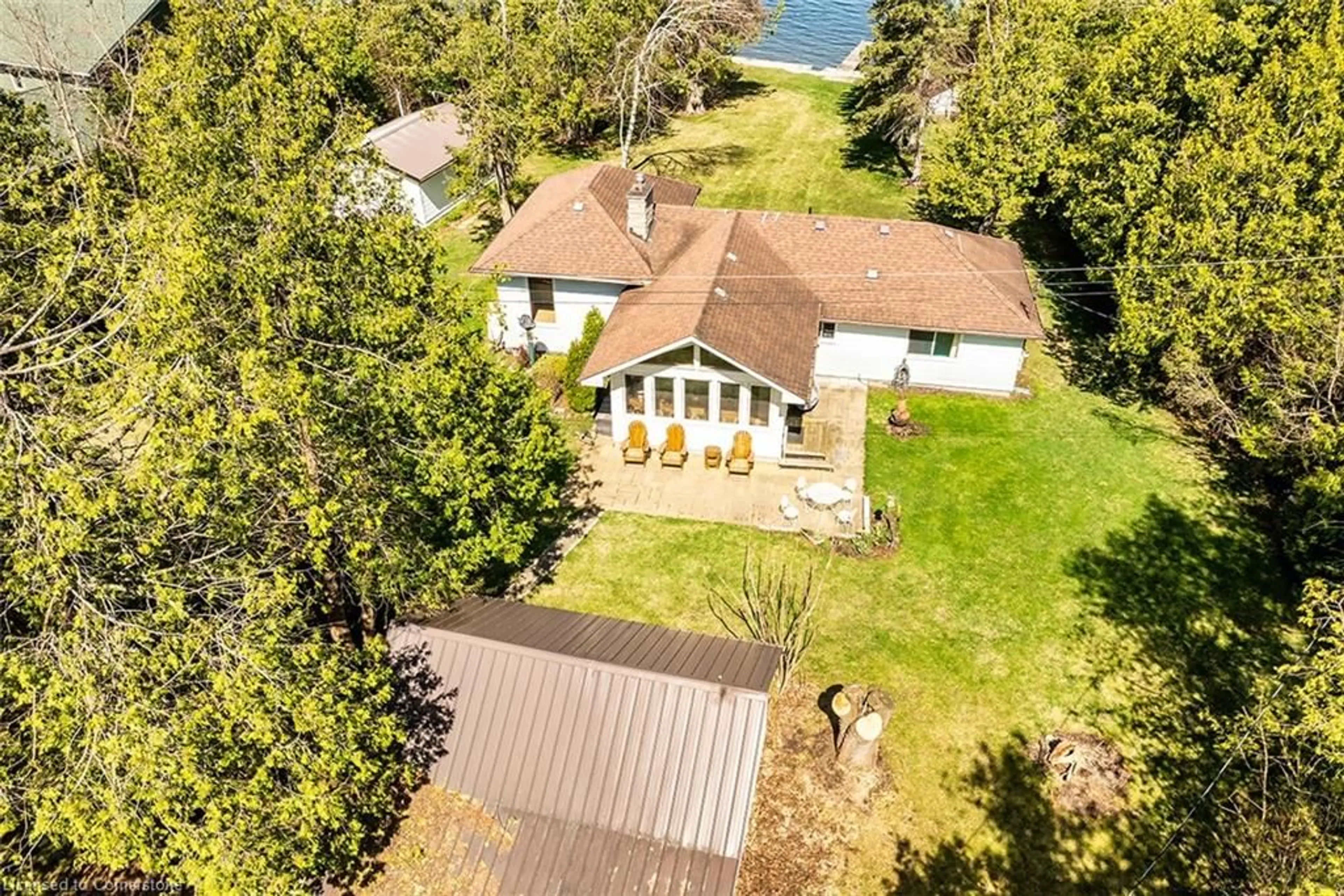 A pic from outside/outdoor area/front of a property/back of a property/a pic from drone, water/lake/river/ocean view for 12 Romany Ranch Rd, Cameron Ontario K0M 1G0