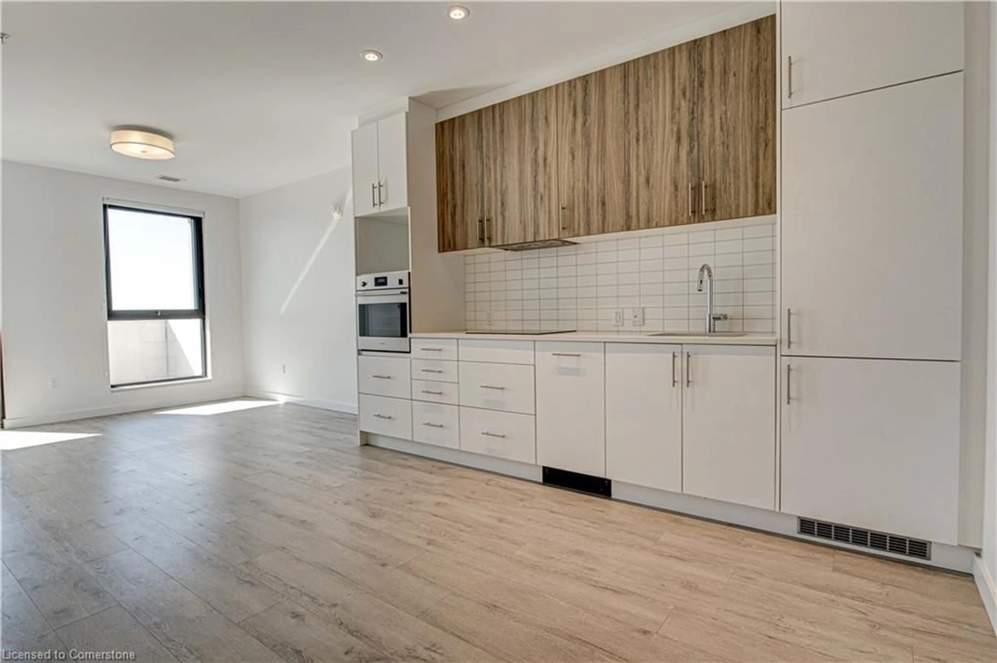 Open concept kitchen, wood/laminate floor for 181 King St #1610, Waterloo Ontario N2J 0E7