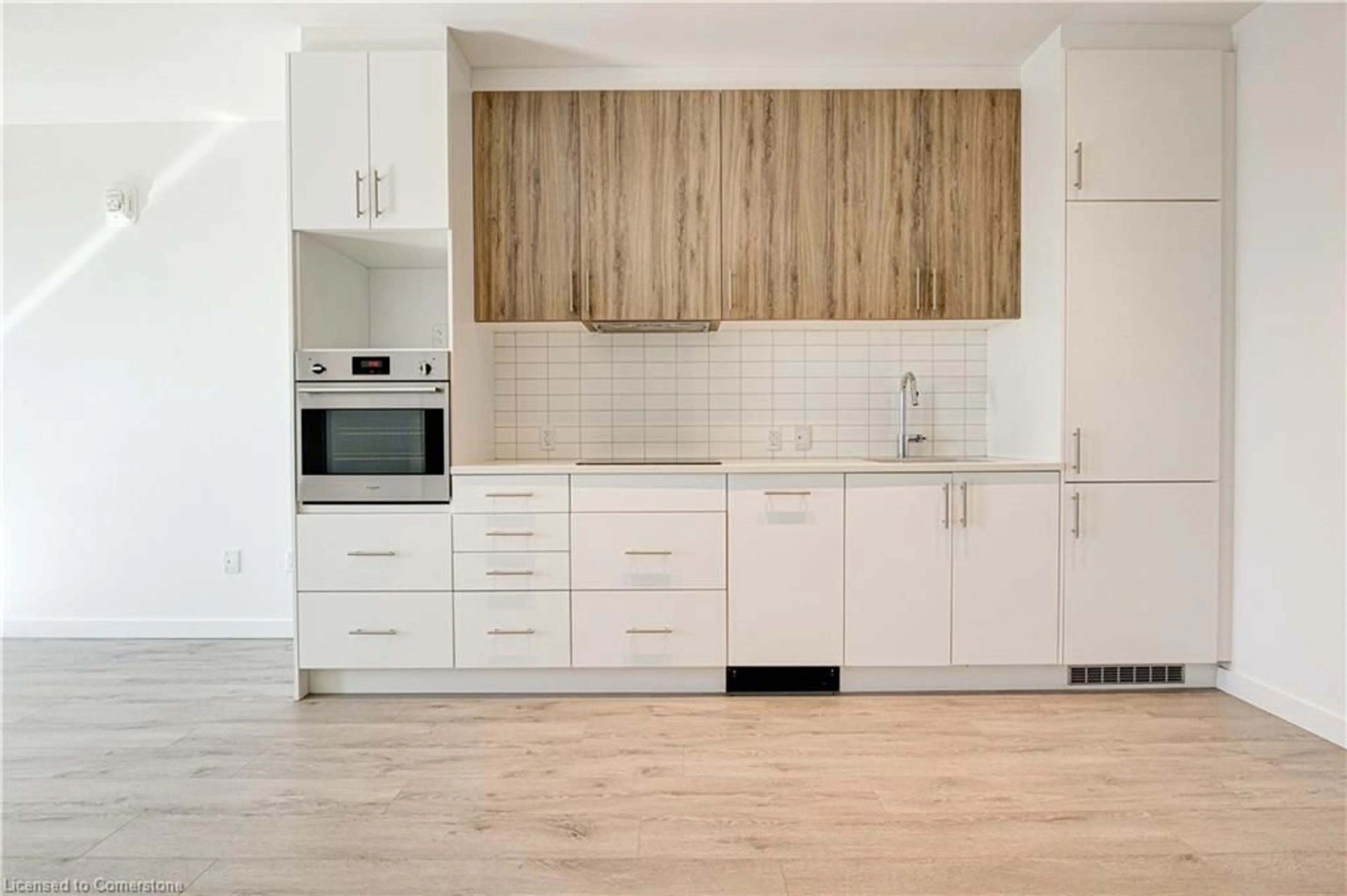 Open concept kitchen, wood/laminate floor for 181 King St #1610, Waterloo Ontario N2J 0E7