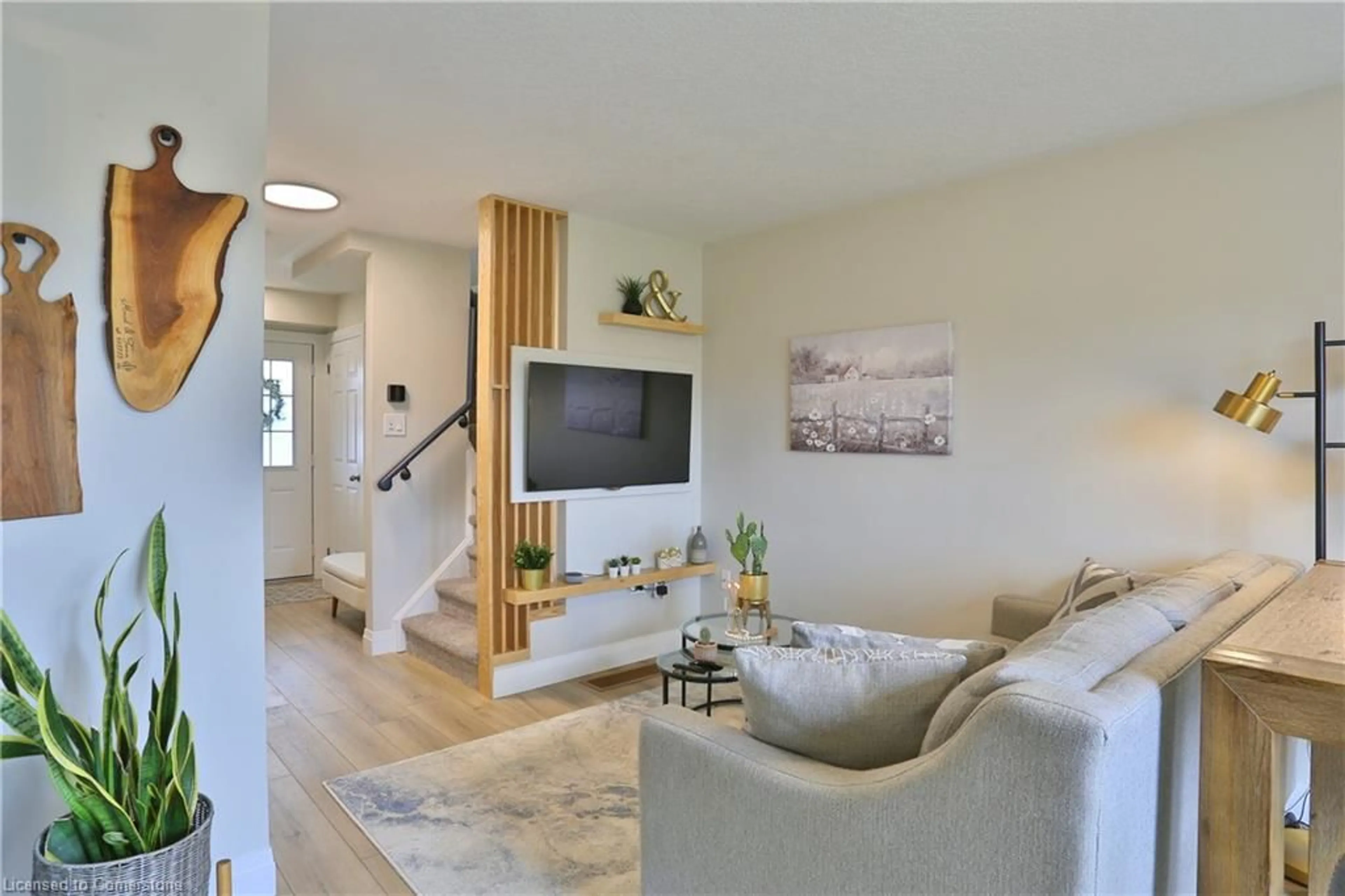 Living room with furniture, wood/laminate floor for 54 Yeaman Dr, Cambridge Ontario N1P 1J6